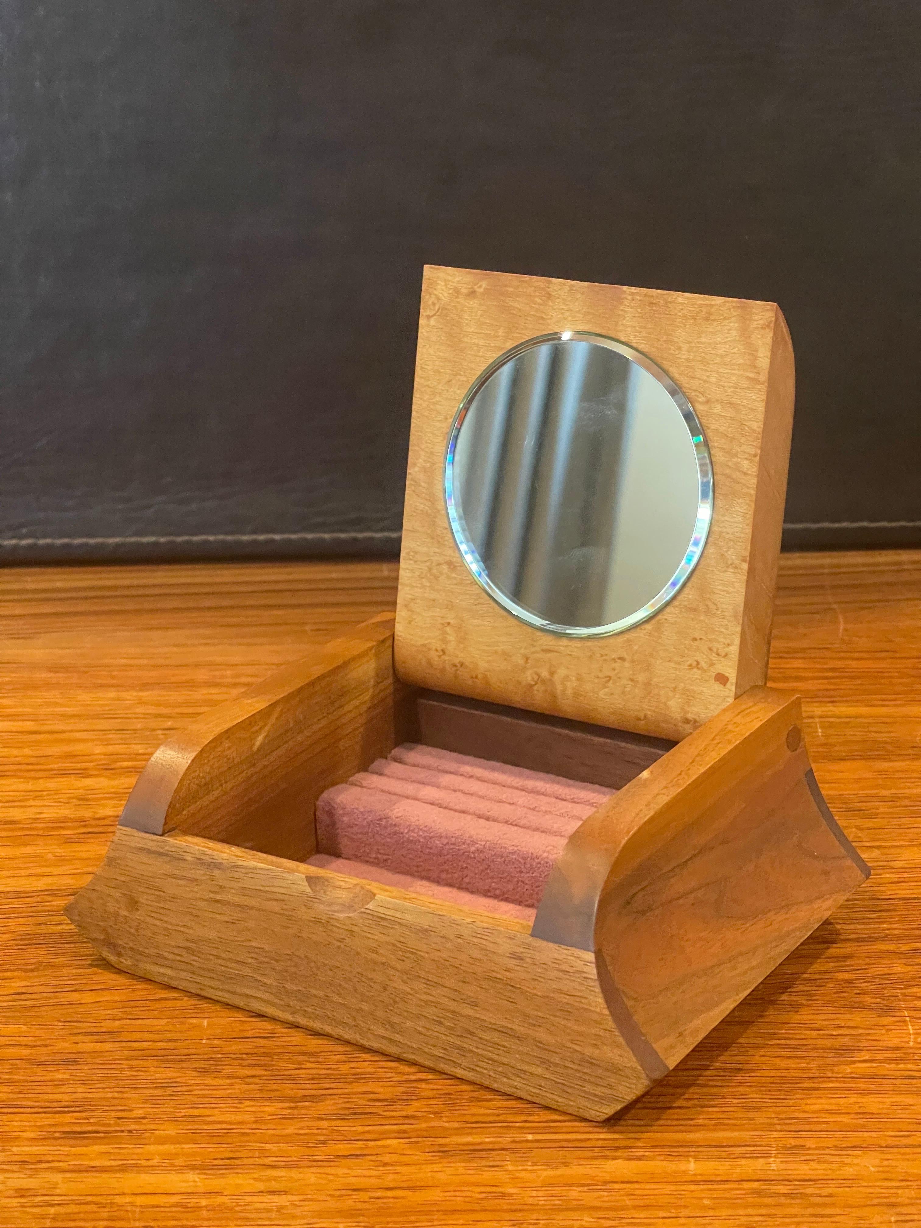 Sleek and stylish petite walnut jewelry box with a burl wood lid, circa 1990s. The piece measures 6.25