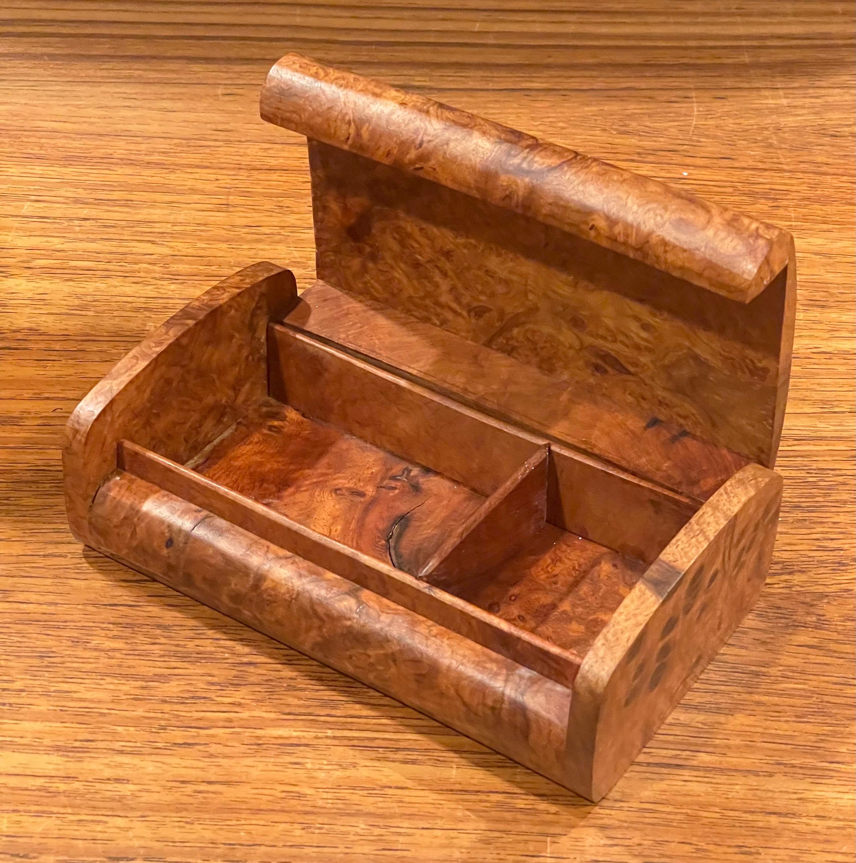 Sleek and stylish burl wood lidded box, circa 1990s. The piece is in very good condition and measures 6.625