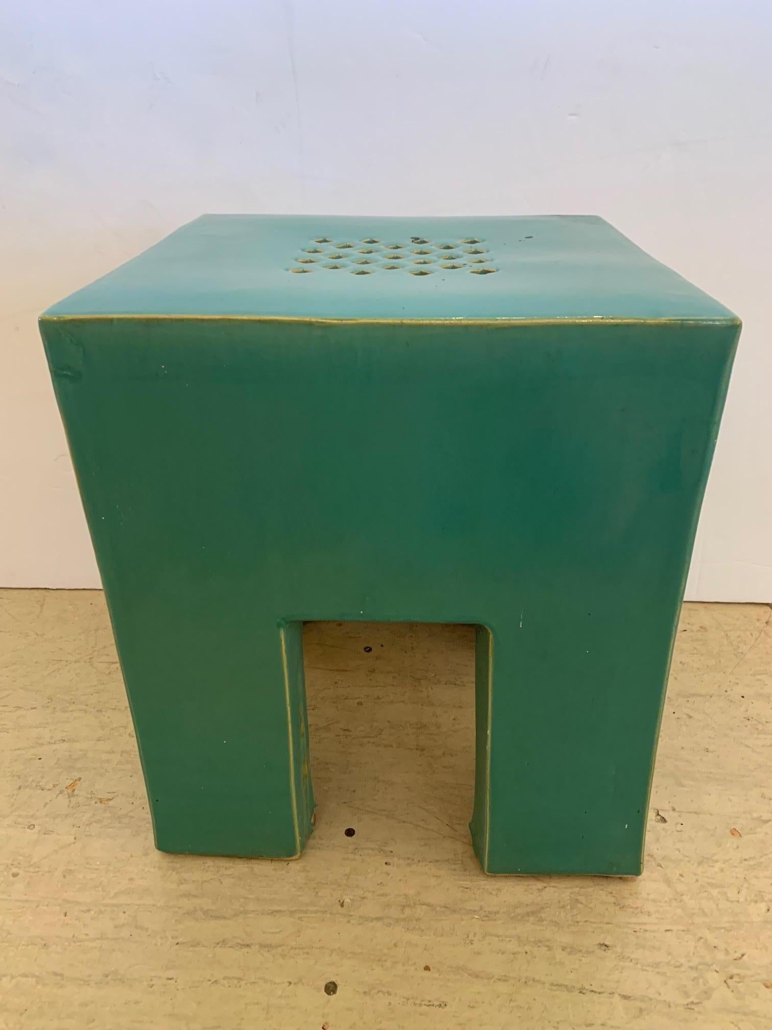 An unusual vintage mid century modern ceramic garden seat in a fabulous shade of celadon, square and sleek. Makes a cool martini table.