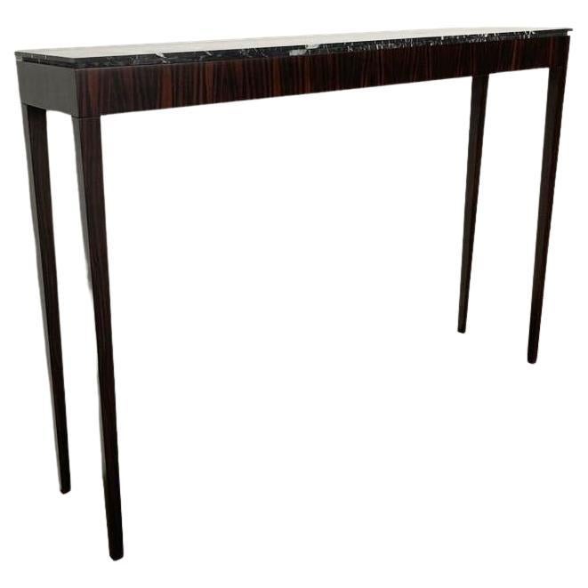 Table console avec plateau en marbre noir et carcasse en placage d'ébène