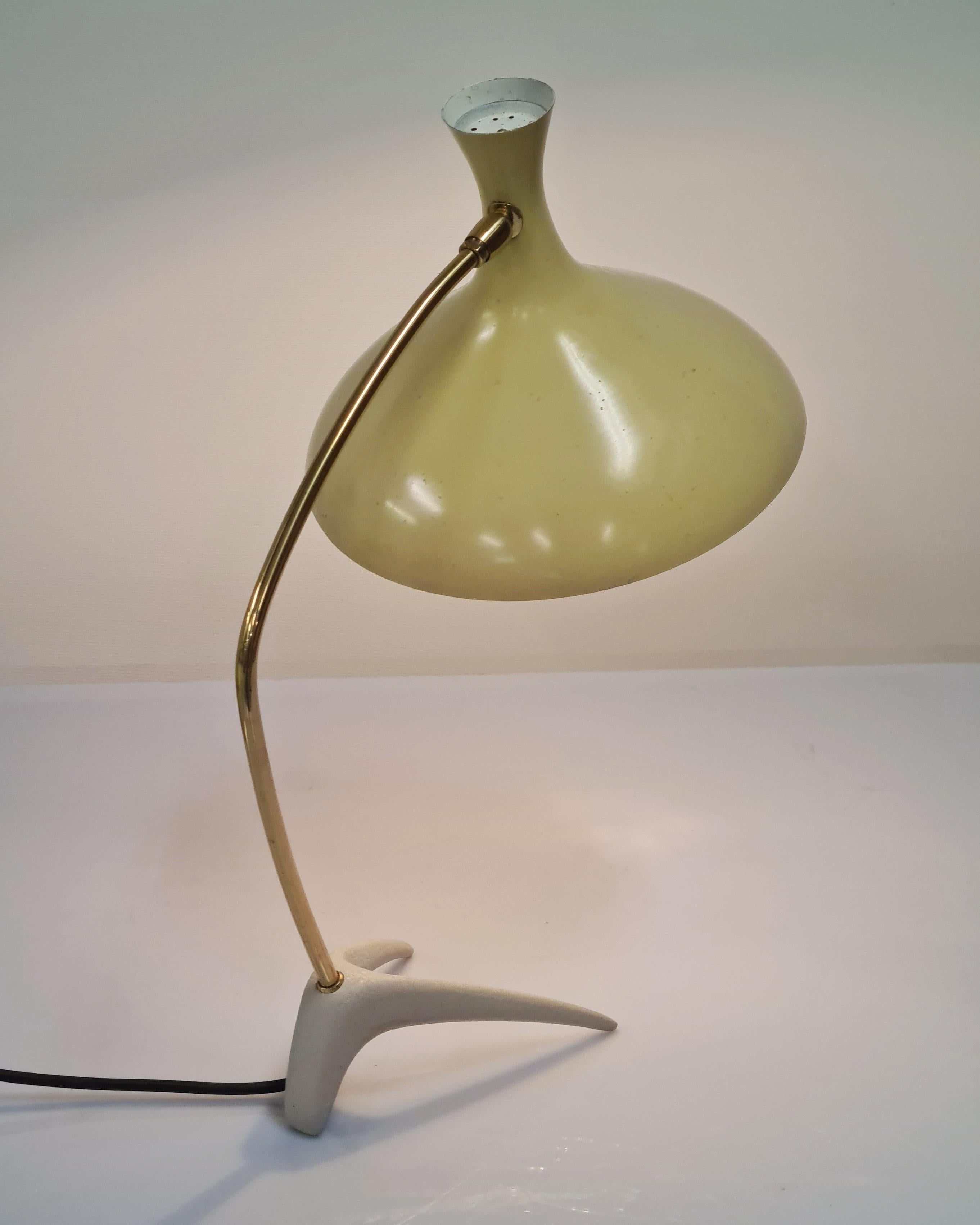 A beautiful sleek lamp by Karl-Heinz Kinsky for Cosack with the crowfoot base. The lamp is in beautiful original and vintage condition except for the changed wirings. The shade is adjustable and makes it perfect for writing desks and working spaces