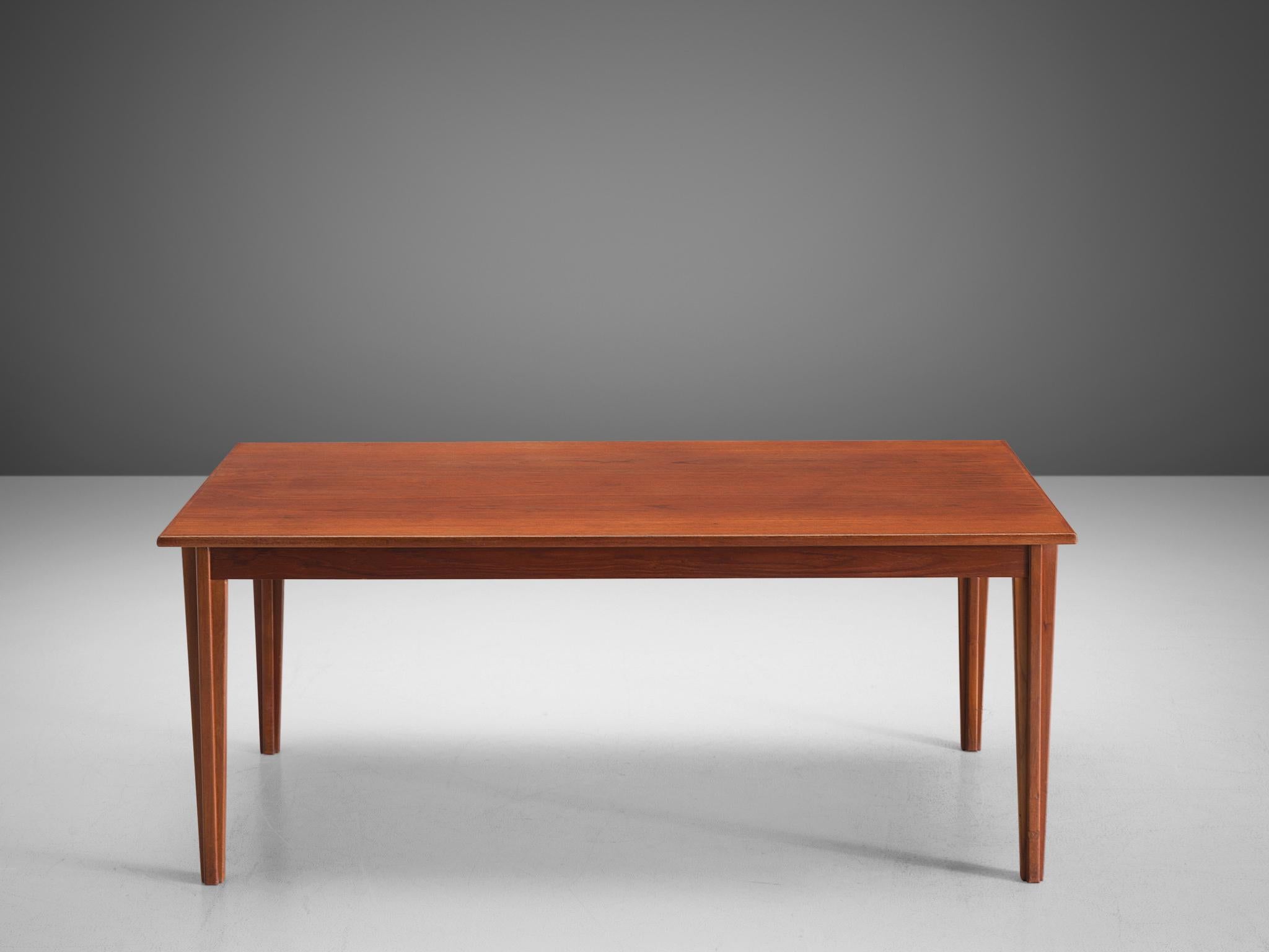 Dining table, teak, Denmark, 1960s.

Beautiful sleek table. rectangular shaped top of this table displays a beautiful grain in the wood. The base consists of four legs and shows beautiful straight lines and solid wood, with classical wood-joints. A