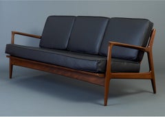 Sleek Danish Modern Sofa by Ib Kofod-Larsen in Teak and Black Leather, 1950s