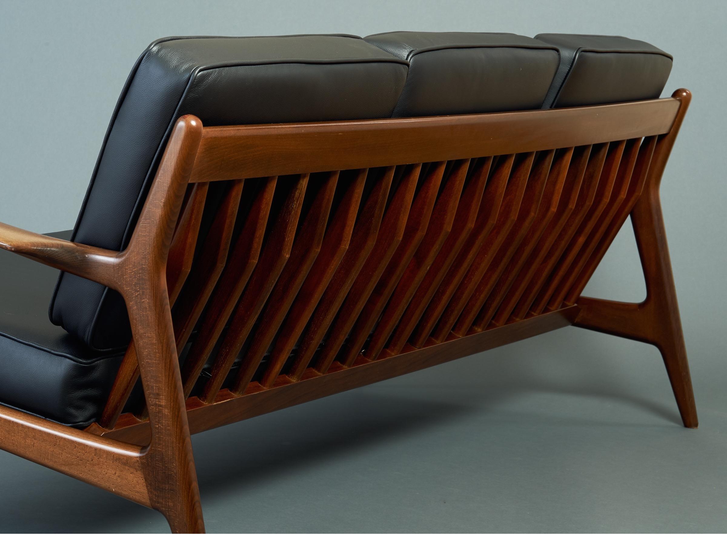 Stained Sleek Danish Modern Sofa by Ib Kofod-Larsen in Teak and Black Leather, 1950s For Sale