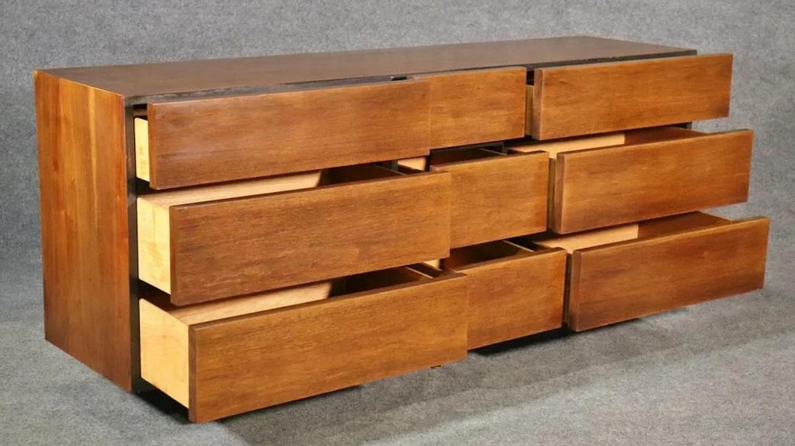 Long mid-century modern dresser made by American of Martinsville. Simple and handsome design with nine wide drawers.
Center drawers: 4.25
