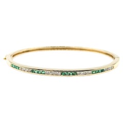 Sleek Emerald & Diamond Bangle in 14k yellow gold