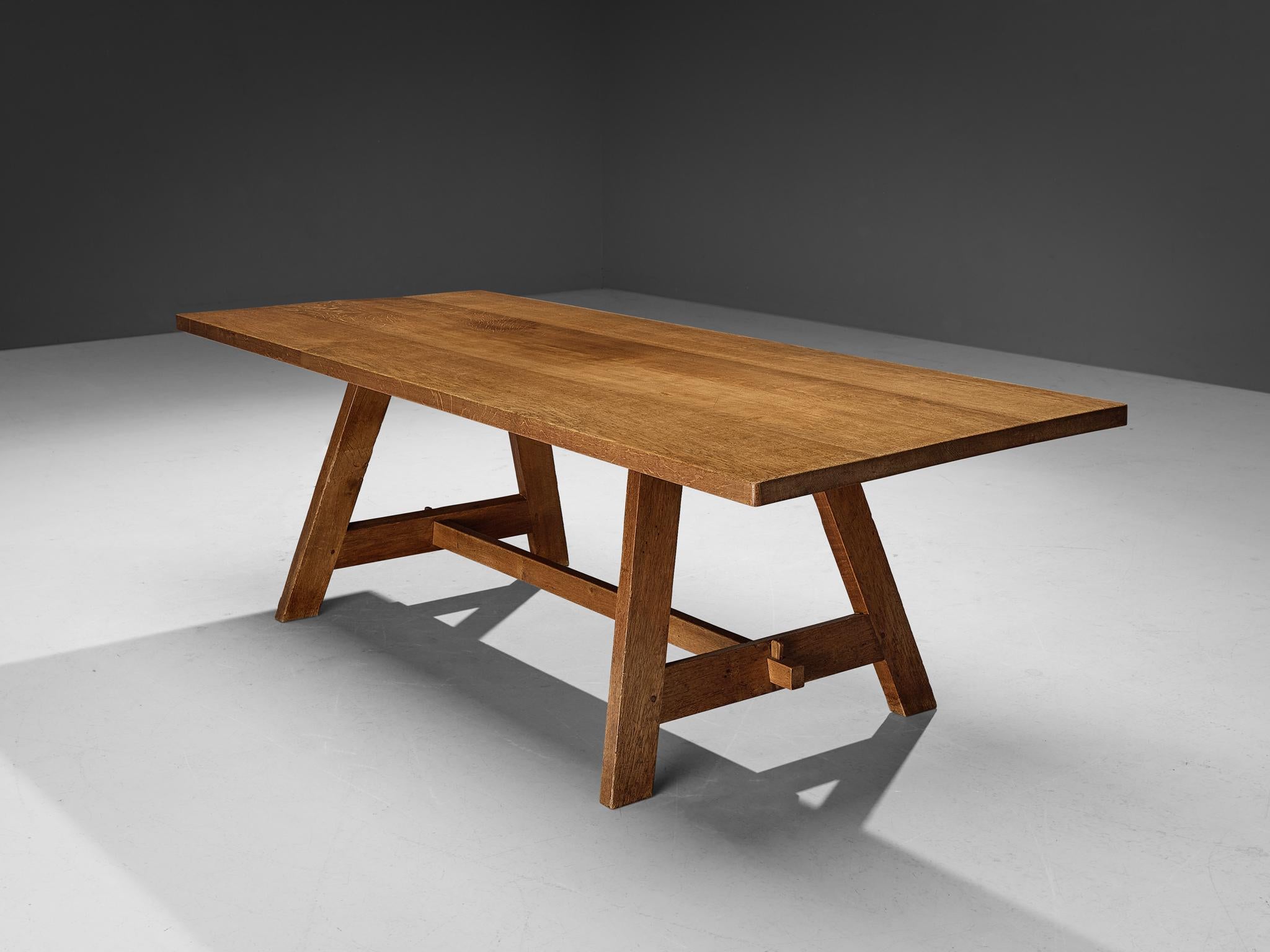 Dining table, oak, France, 1960s

This elegant dining table is made in France in the 1960s. It has a sculptural base with a supporting beam, visible wooden connections and tapered legs. This piece is made in solid oak and has great quality to it.