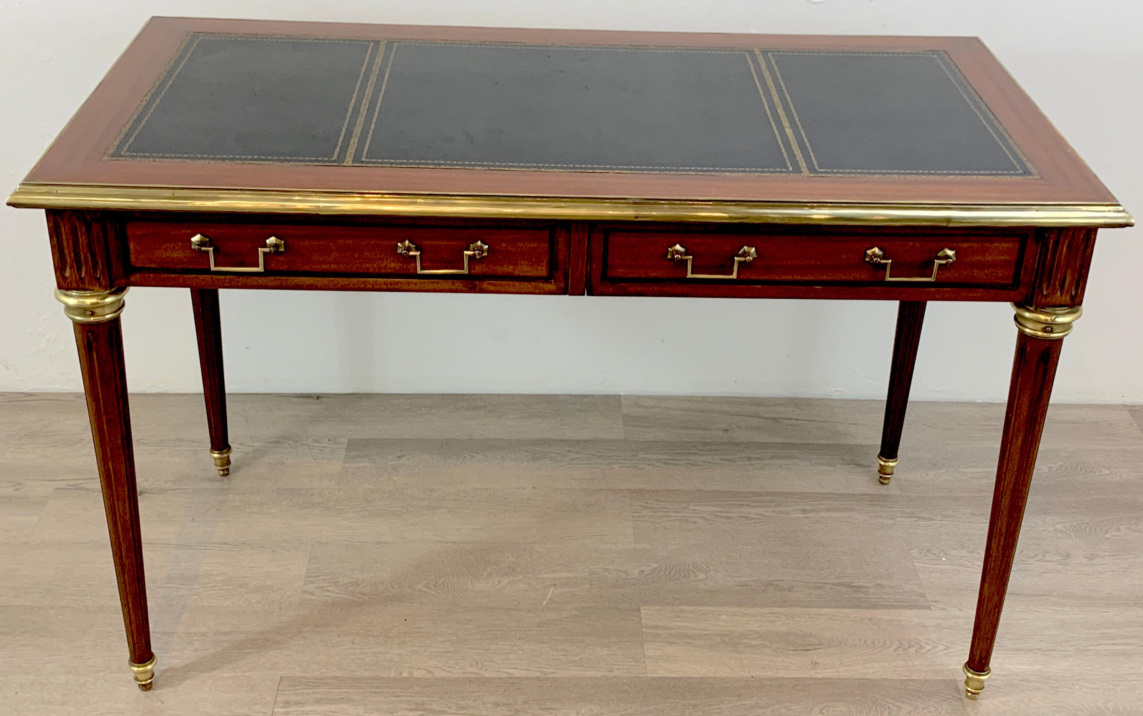 Sleek French Directoire style desk, circa 1960, superior quality, Brass mounted case, with inset tooled black leather top, one side fitted with two 20