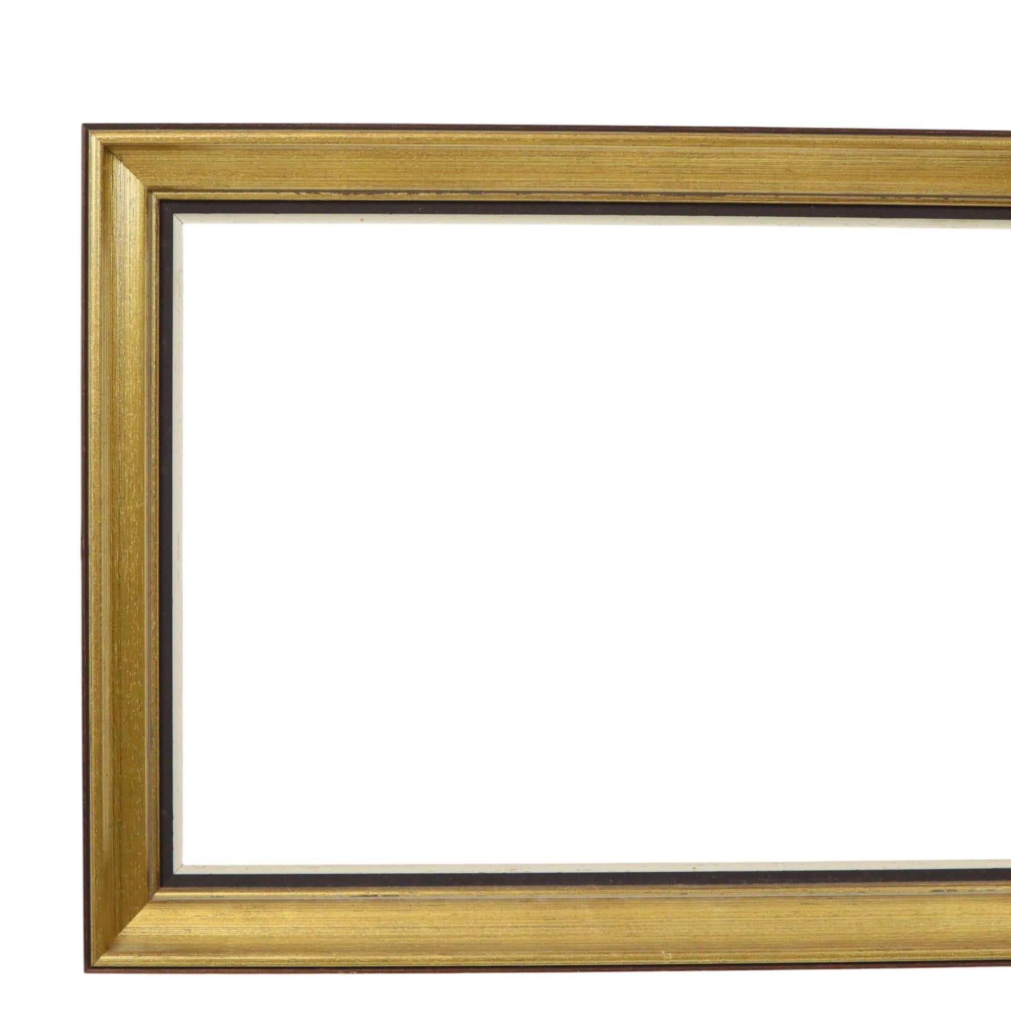 A sleek, vintage gold-colored frame made of solid wood and plaster, entirely in a classic style, circa the second half of the 20th century.

This frame is understated and elegant, not at all extravagant, ideal for showcasing an existing or your own
