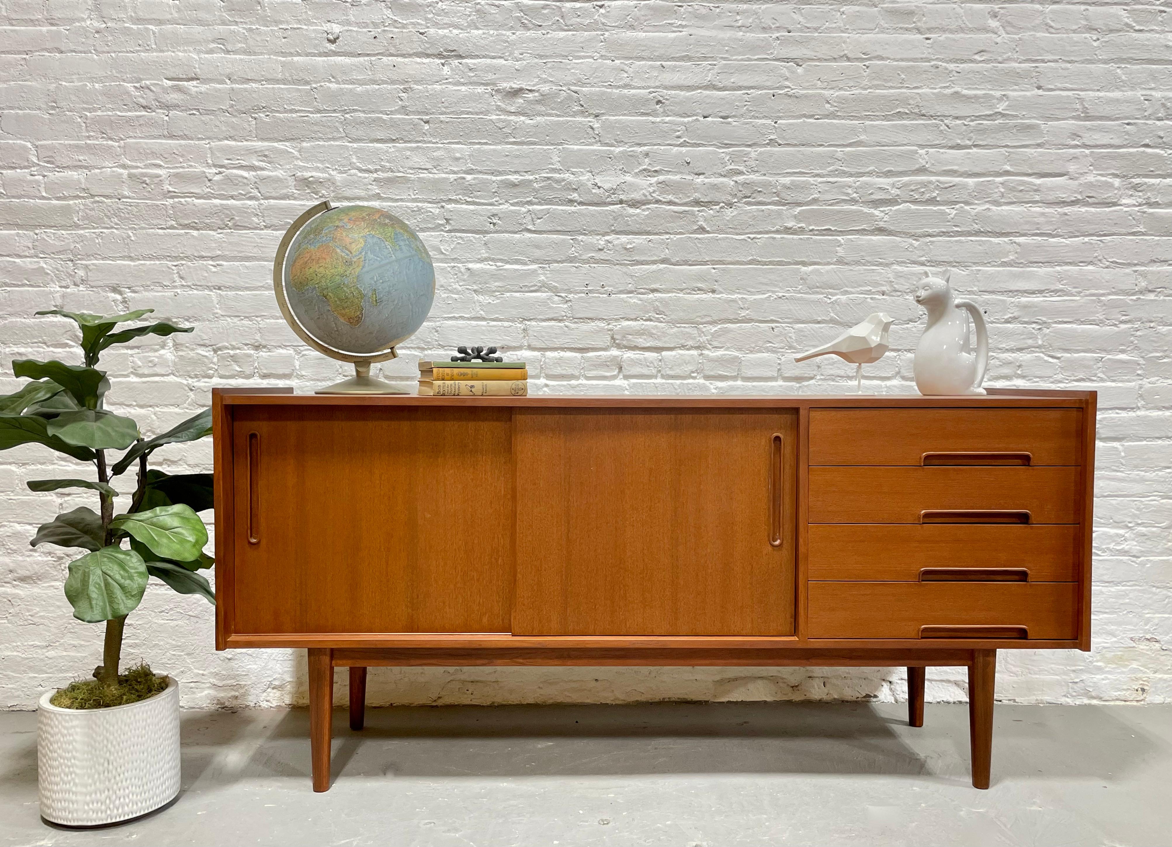 Mid Century Modern styled Handcrafted Credenza / Media Stand. This beauty features exquisite inset hand pulls along the doors and drawers with recessed trim. Stunning wood grains and finished back allow you to float the credenza in a room. Excellent