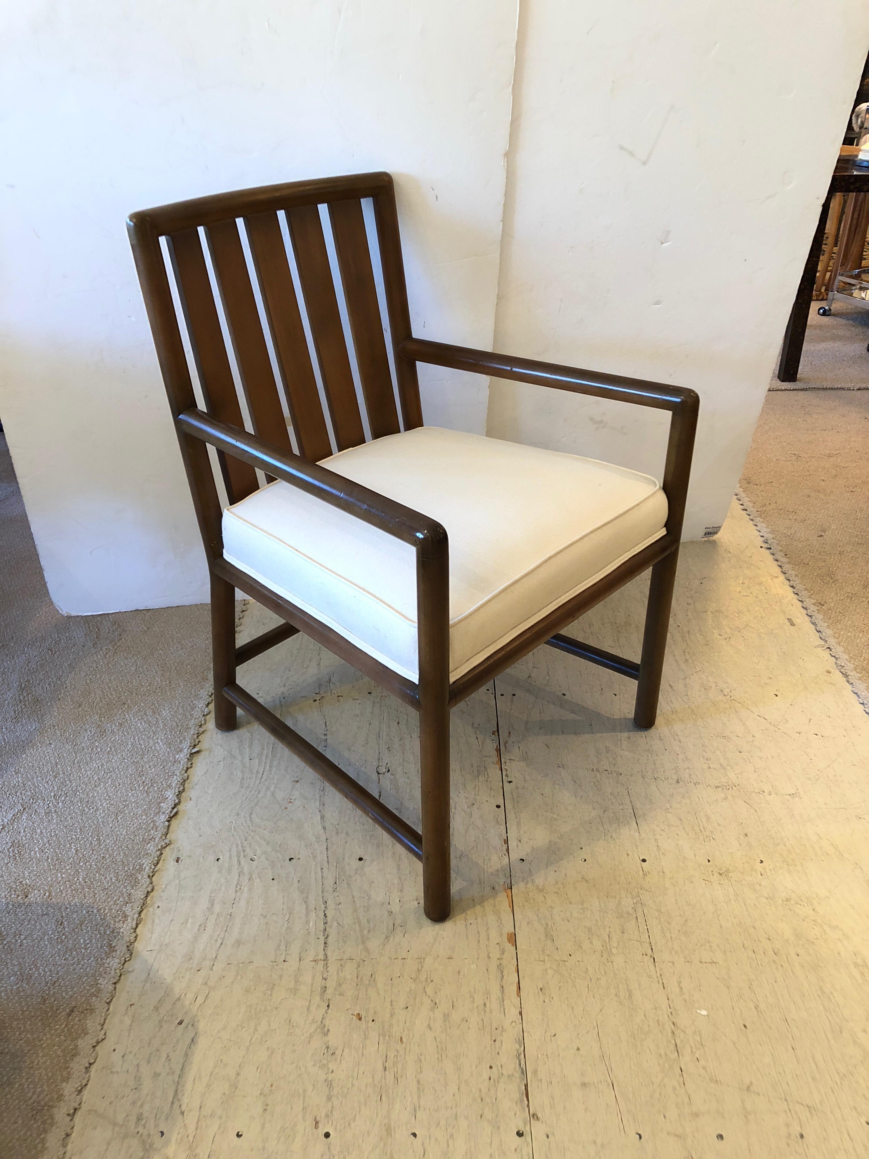 Masculine and sleek walnut Mid-Century Modern armchair by Robsjohn Gibbings with new white duck upholstered seat.