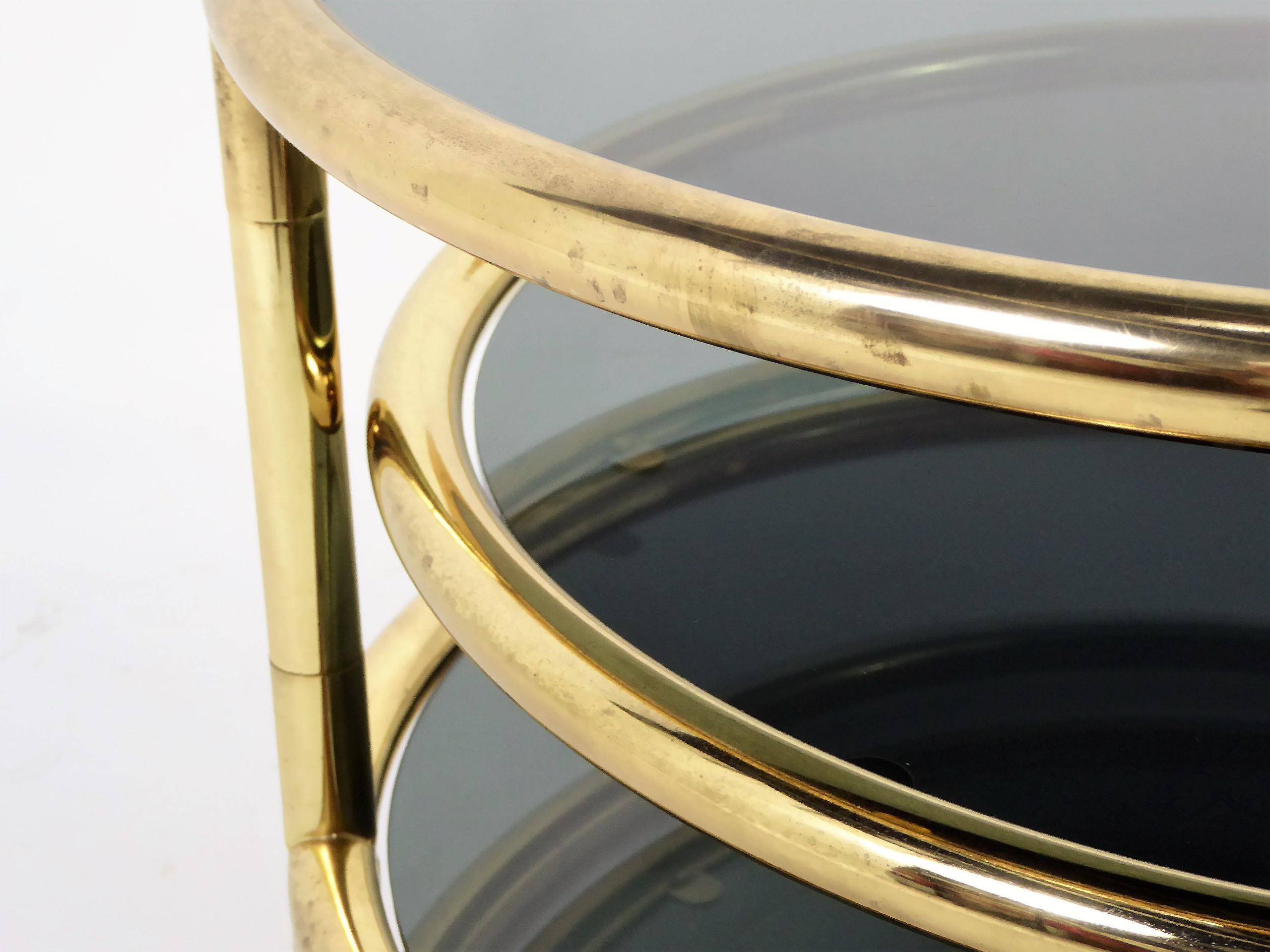 Sleek Milo Baughman Style Brass and Glass Swiveling Coffee Table 5