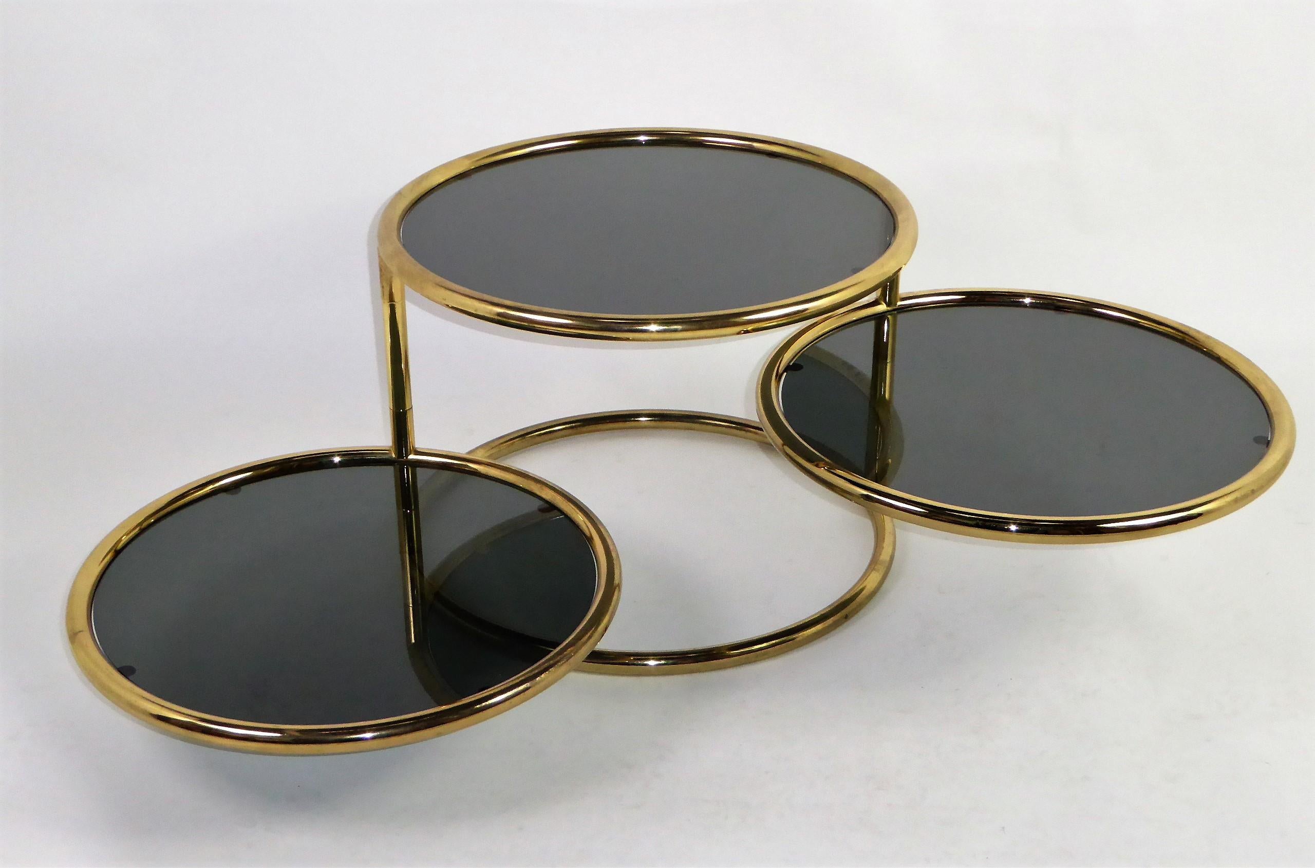 Mid-Century Modern Sleek Milo Baughman Style Brass and Glass Swiveling Coffee Table
