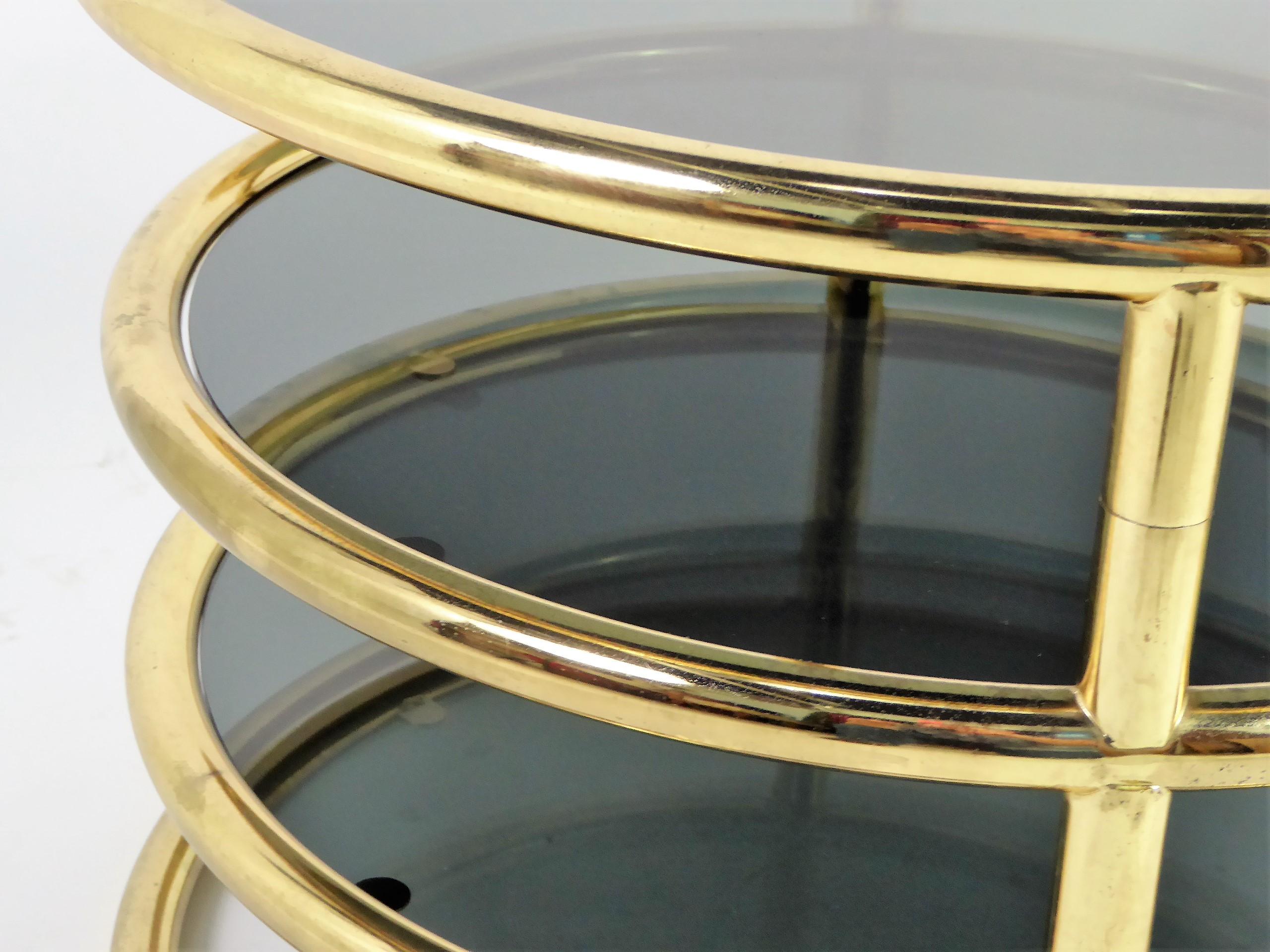 Sleek Milo Baughman Style Brass and Glass Swiveling Coffee Table 1