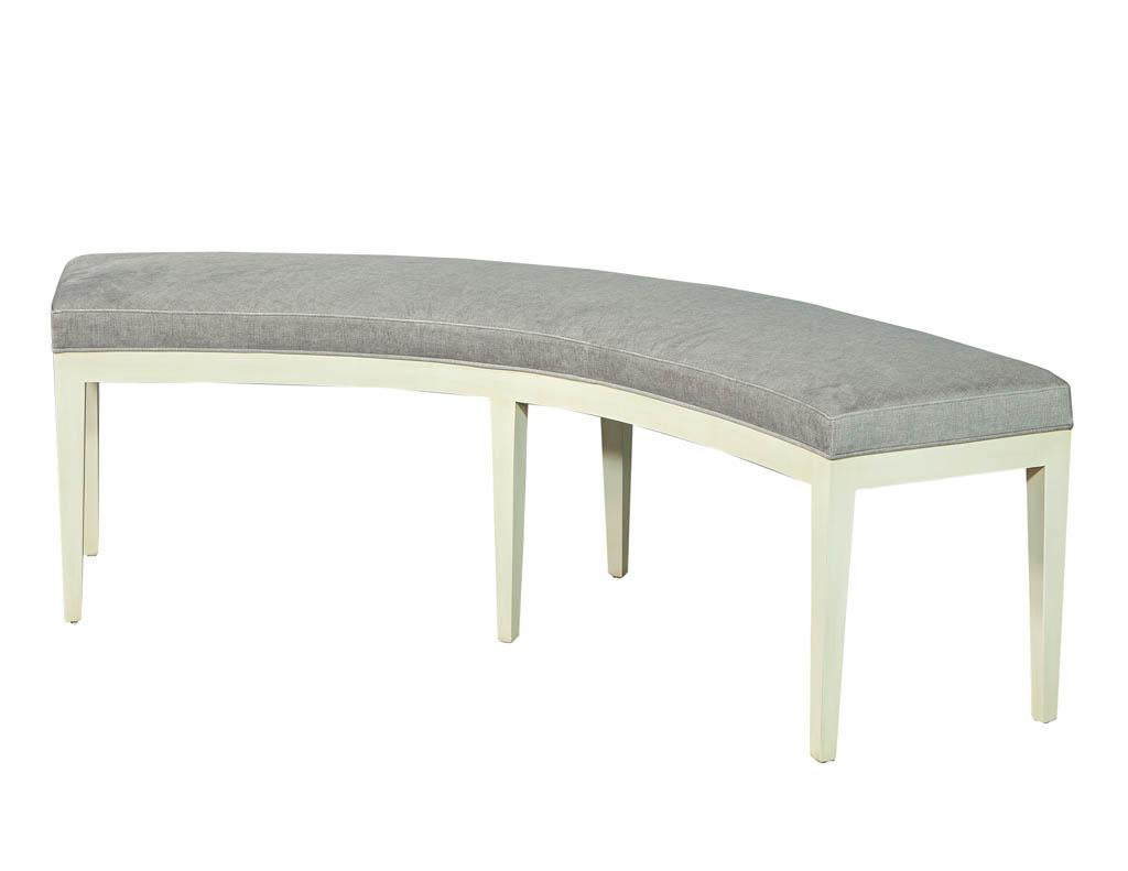 Sleek modern curved bench by Carrocel. With a simple clean base and curved velvet upholstered seat. This piece is made to order custom. Price includes complimentary curb side delivery to the continental USA.