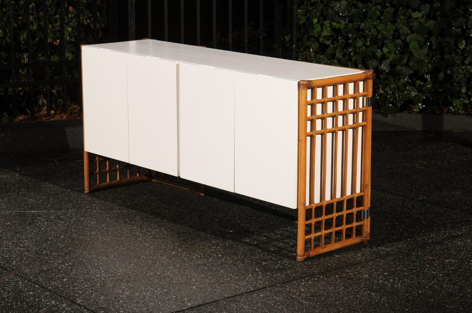 Late 20th Century Sleek Restored Cream Lacquer Cabinet with Rattan and Cane Accents, circa 1975 For Sale