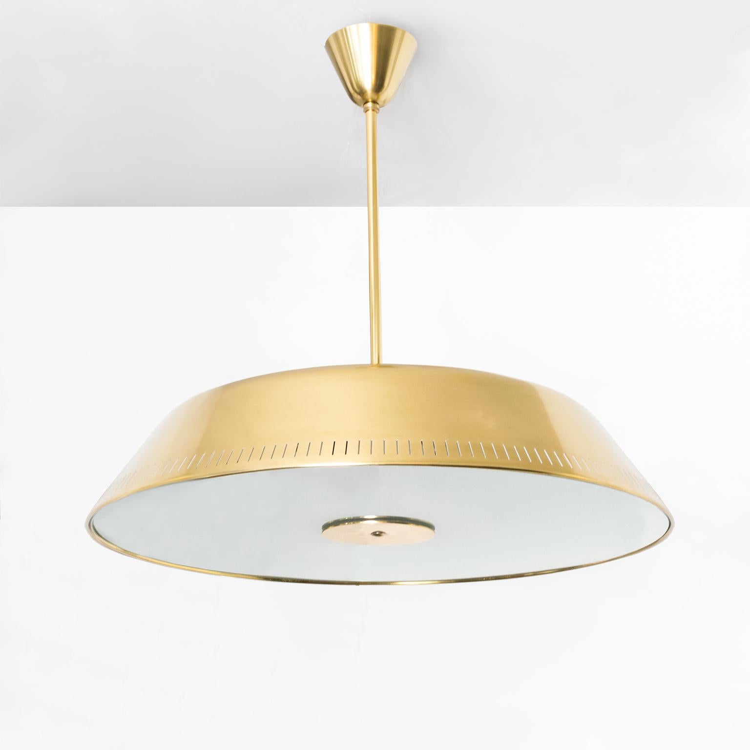 Sleek Scandinavian Modern polished brass and glass pendant designed by Harald Notini made by Böhlmarks, Sweden. This fixture has been completely restored, (polished and lacquered) and newly rewired for us in the USA with 6 internal standard base