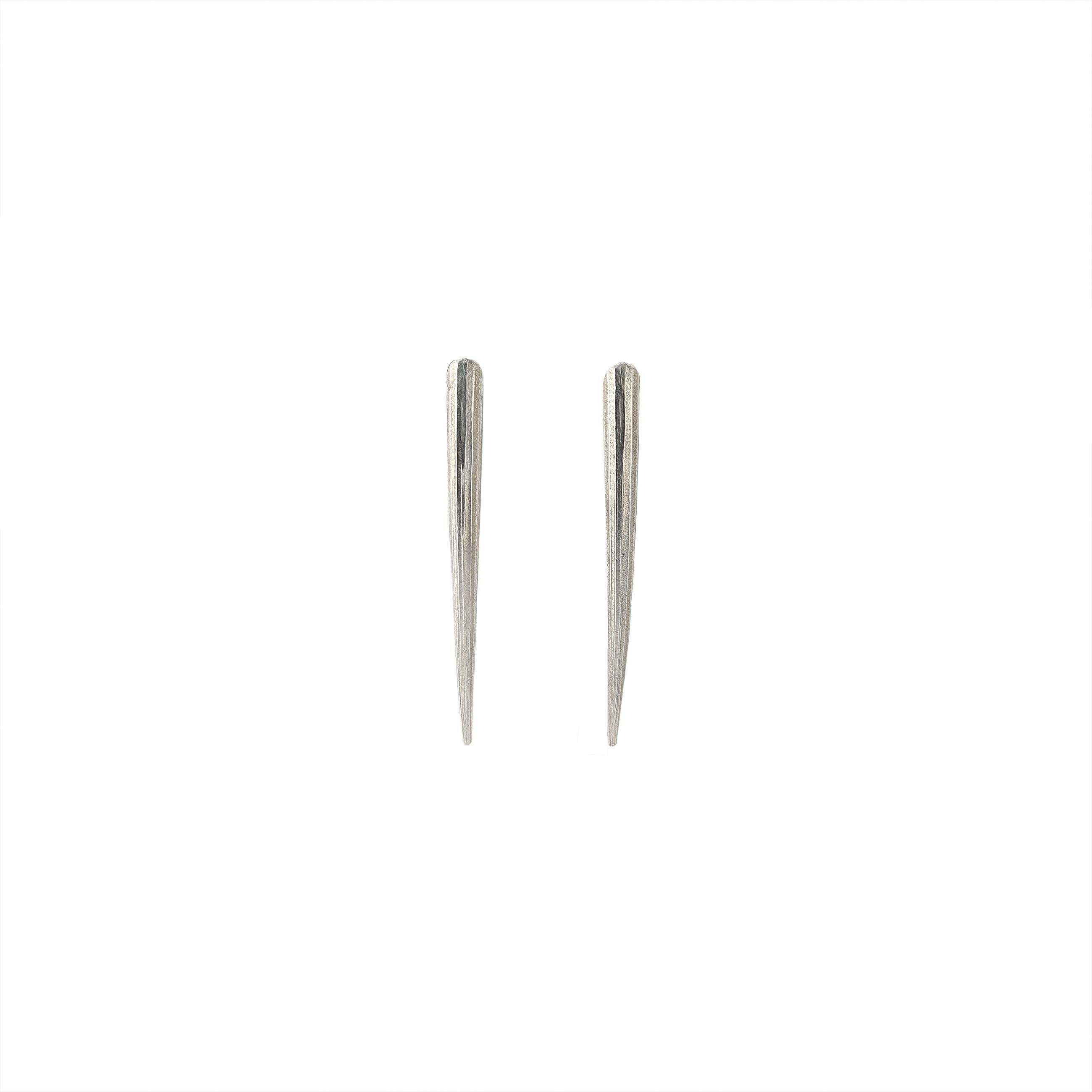 Sterling Silver Small Tusk earrings measure 1.75 inches long and feature sterling silver posts. Hand-made t order by Lauren Newton. 

Each piece is made to order so please allow extra time for delivery. Contact seller for delivery timing. 

Earrings