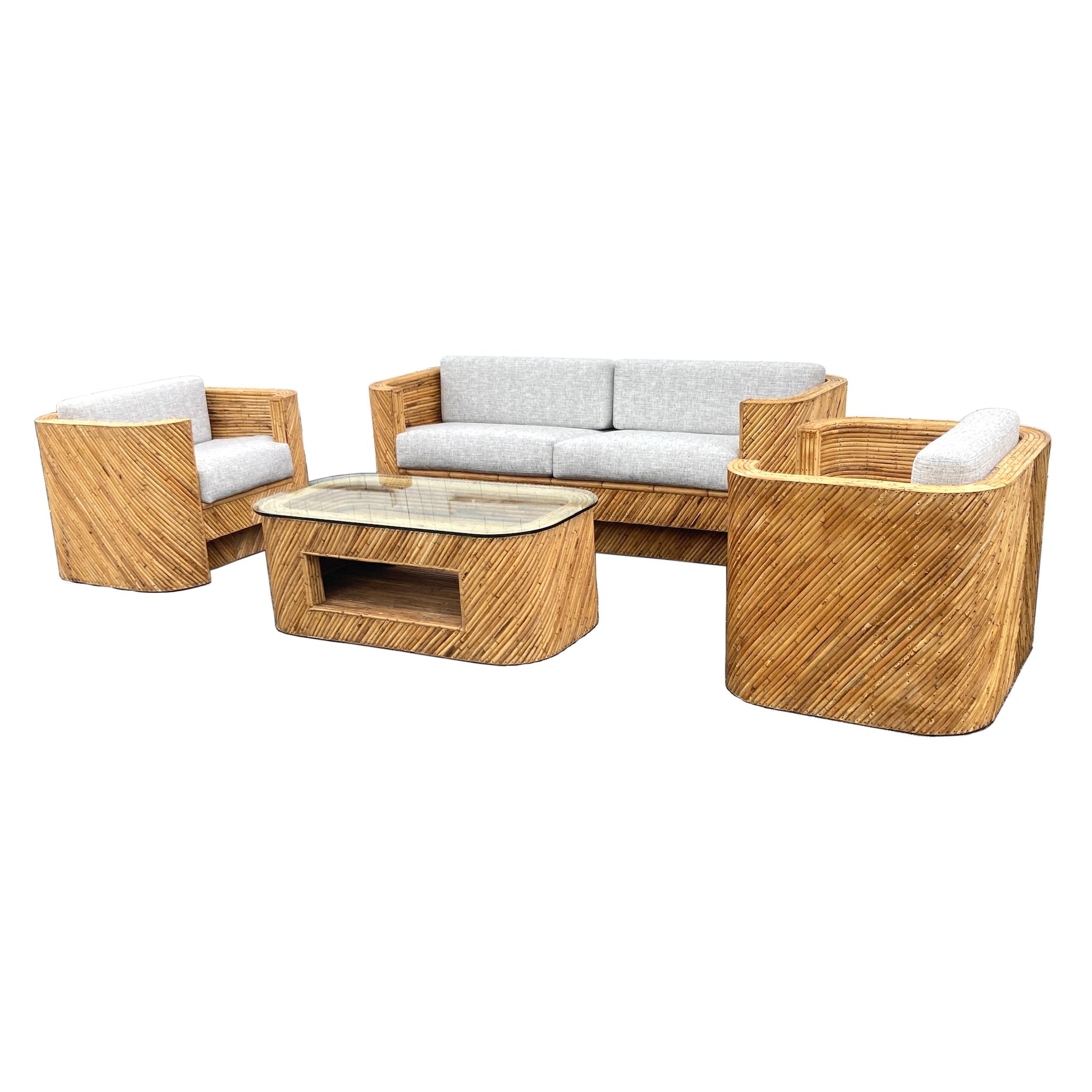 This set of bamboo furniture epitomizes the Machine Age with its low-slung streamlined look. No frills or embellishments interfere with its pared-down simplicity. The effect is heightened by the rusticity of the darkened original nailheads and the