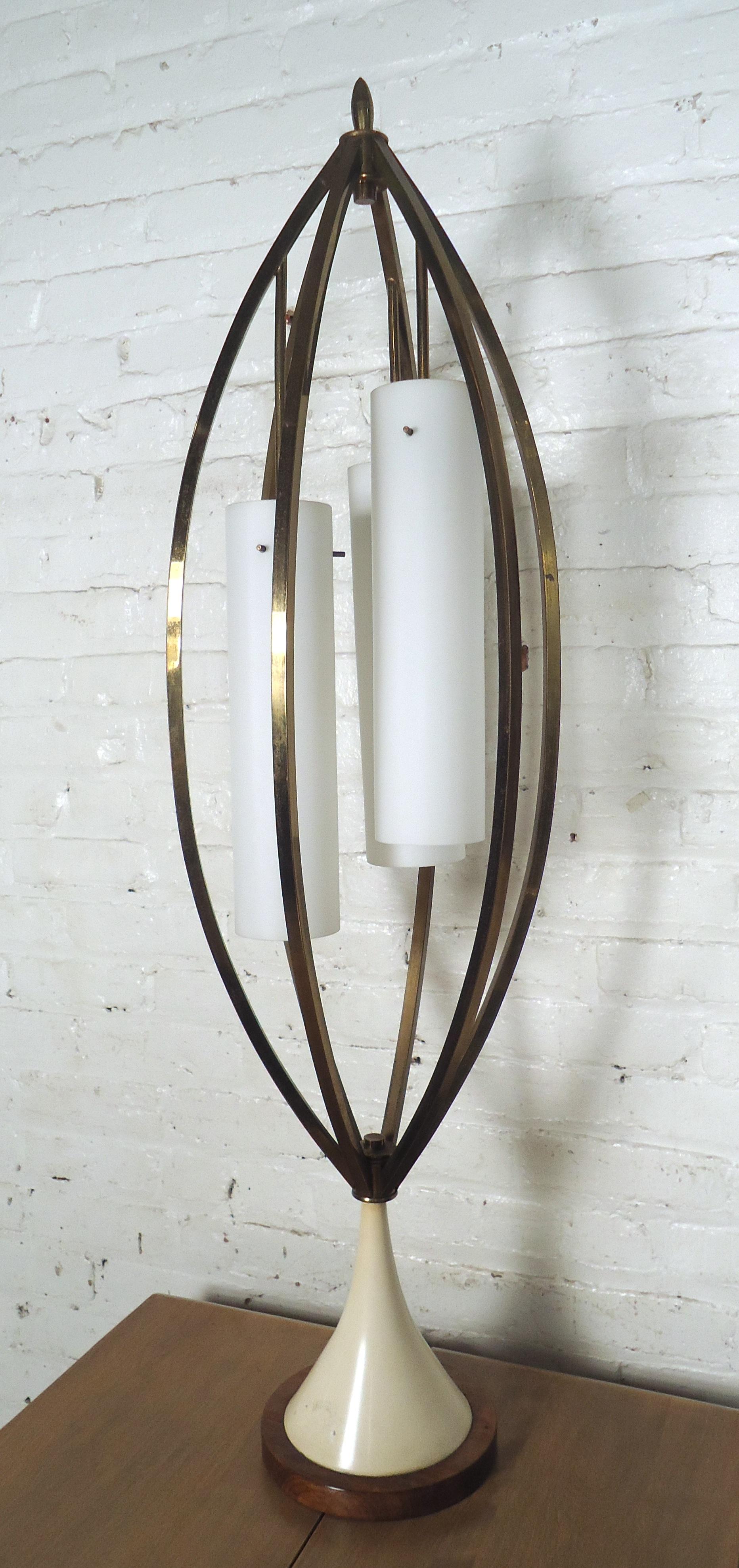 Mid-Century Modern brass table lamp features three white glass shades, brass frame and tulip style base.
(Please confirm item location - NY or NJ - with dealer).