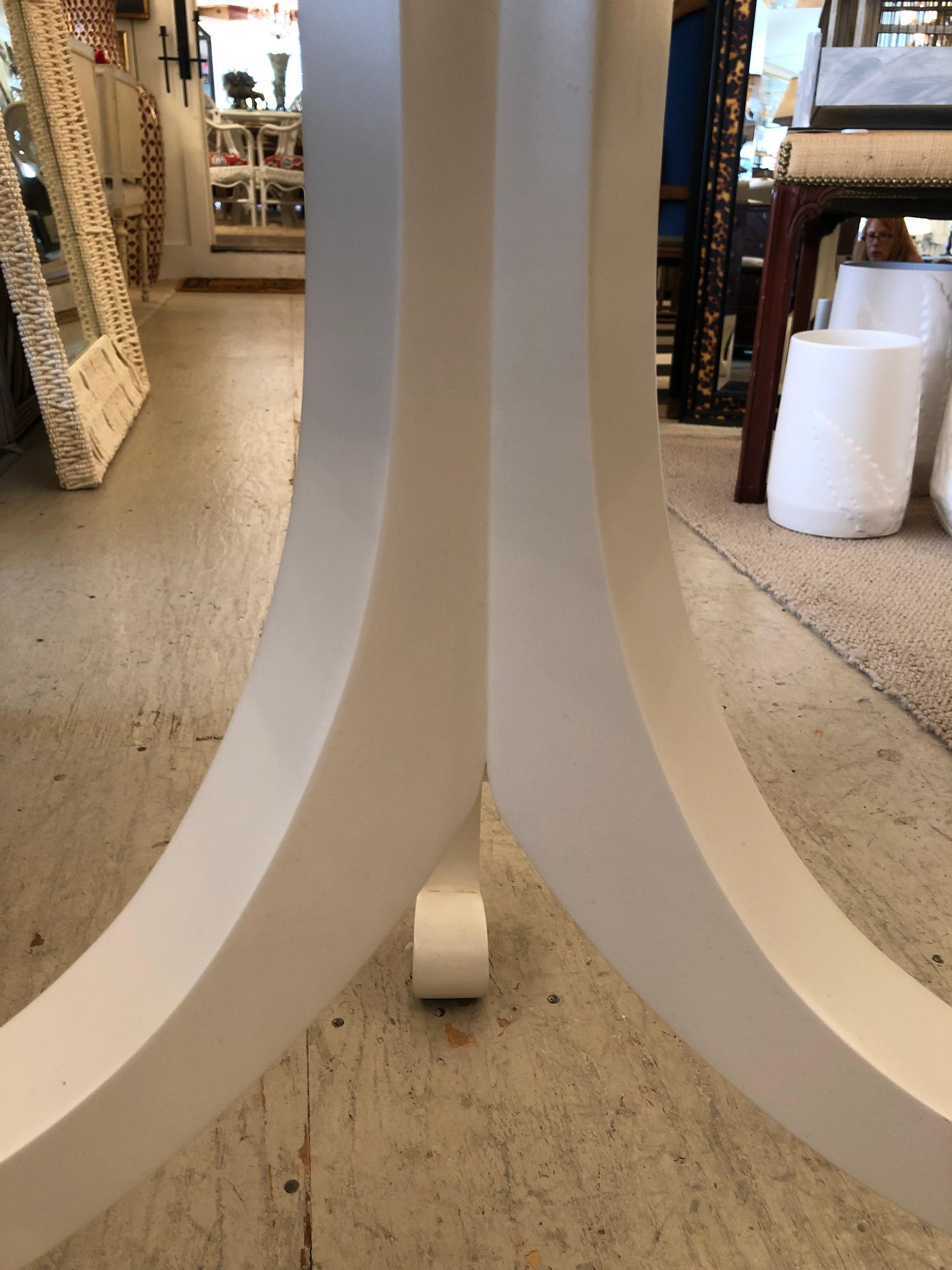 Sleek White Round Breakfast Table with Tripod Legs 1