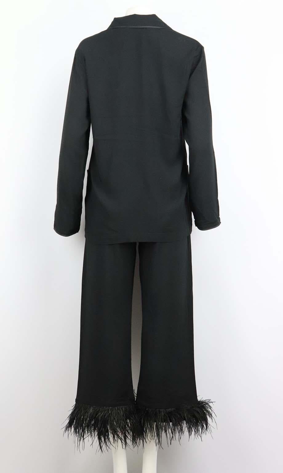 This pyjama set by SLEEPER is made from lightweight crepe de chine, and inspired by vintage pyjama set which features a black shirt with tonal piping and mother-of-pearl buttons, the cropped pants have an elasticated waist and the brand's signature