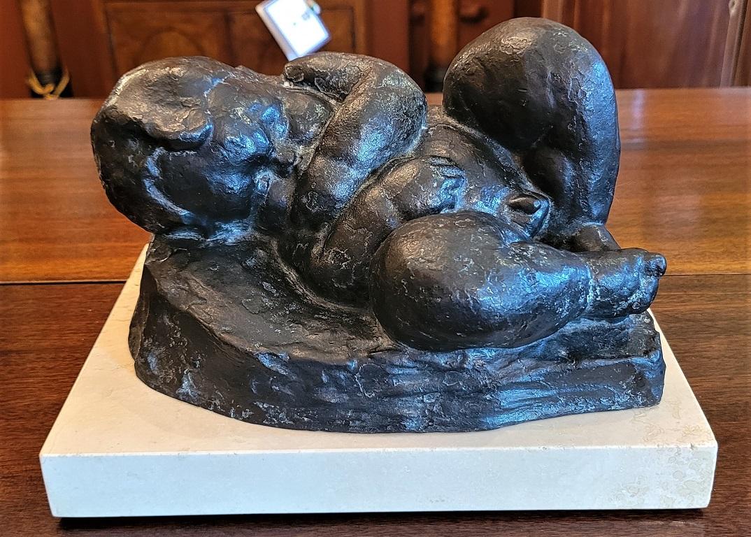Presenting a stunning Sleeping Baby Bronze by Charles Umlauf.

A Wonderful piece of contemporary American Sculpture by a famous American/Texas Sculptor.

It features a dark bronze patinated sculpture of a sleeping baby sucking his thumb, whilst