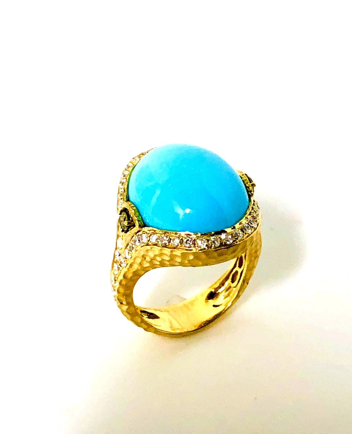 This stunning ring features a huge and absolutely gorgeous oval turquoise cabochon from the renowned Sleeping Beauty Mine in Arizona. Although famous as the site of some of the most beautiful 