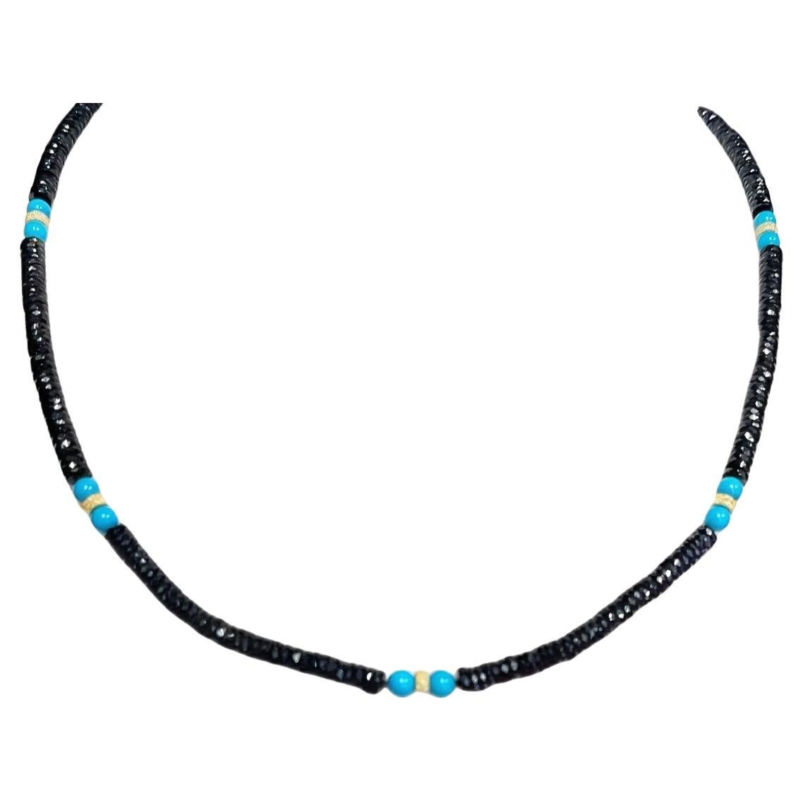 This gorgeous necklace features a striking combination of faceted black spinel crystal rondels and 
