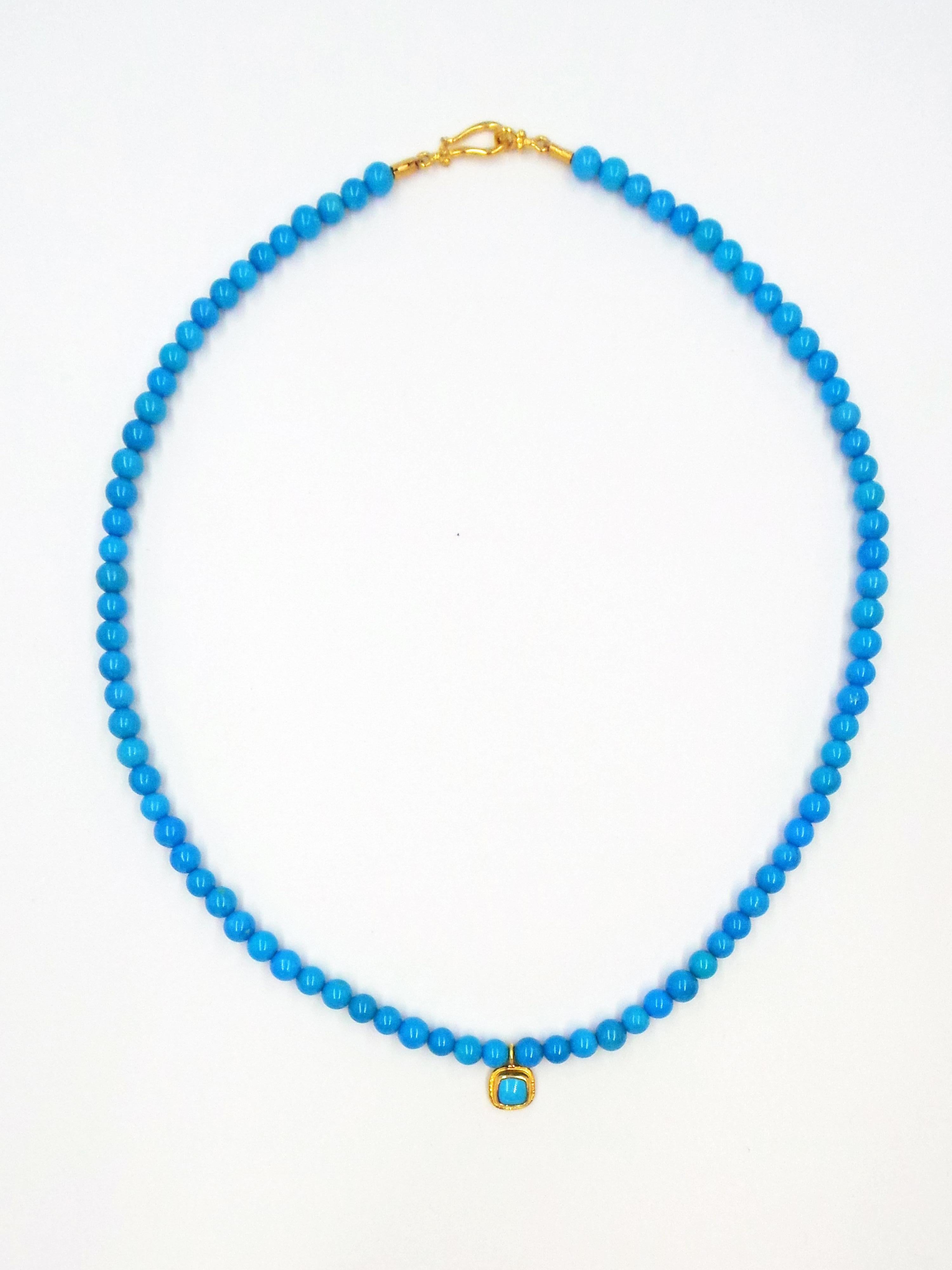 Necklace, ring and earrings set comprised completely of high-grade Sleeping Beauty Turquoise and 22k yellow gold. Necklace is made of round, 5mm Turquoise beads, solid hook closure, and rounded square or cushion shaped Turquoise gemstone cabochon in