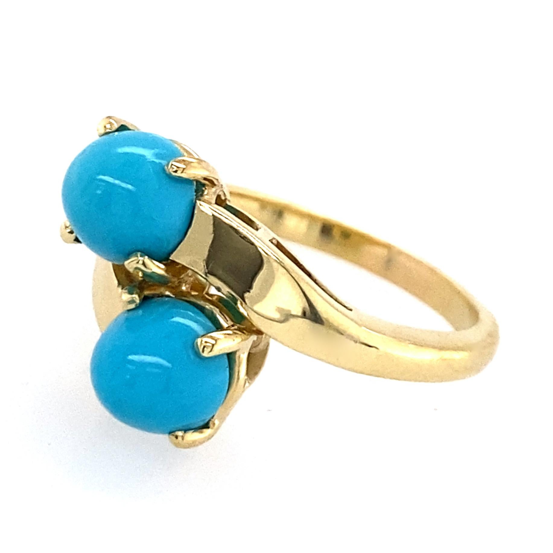 This ring spent most of its career as an excruciatingly boring pearl bypass ring.  We breathed new life into it by replacing the pearls with two gorgeous, chewy little bullet cabochons of turquoise from the famed Sleeping Beauty mine in Globe,
