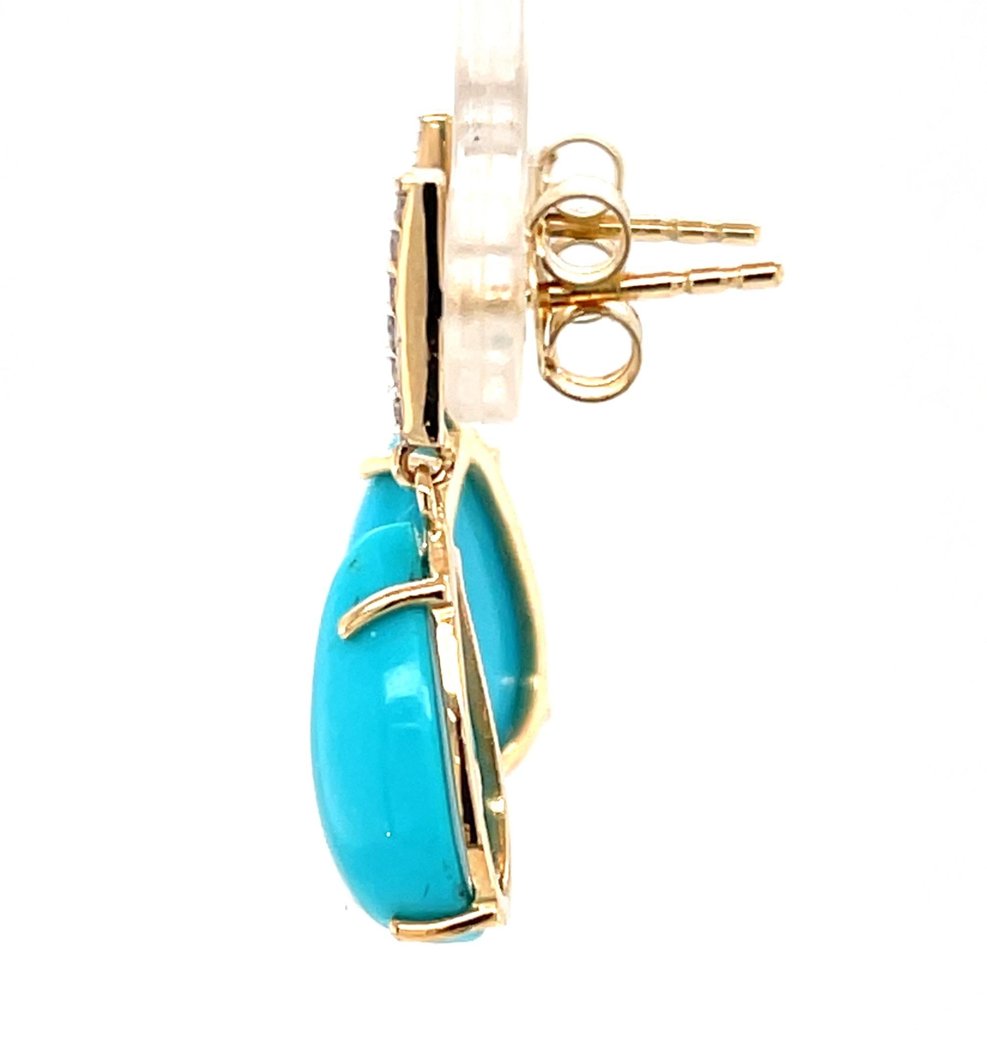These eye-catching turquoise drop earrings feature a beautifully matched pair of stunning Sleeping Beauty turquoise cabochons weighing 8.65 carats, set with sparkling natural diamonds in 14k yellow gold. Turquoise from the now-closed Sleeping Beauty