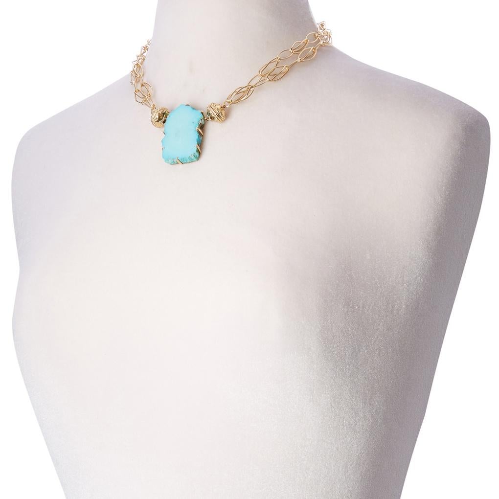 Get connected with nature with this beautiful slice of sleeping beauty turquoise. This piece is reversible to mother of pearl and set in 14K yellow gold prongs with 14k plated yellow gold magnetic clasps. 

Create your own perfect look by pairing
