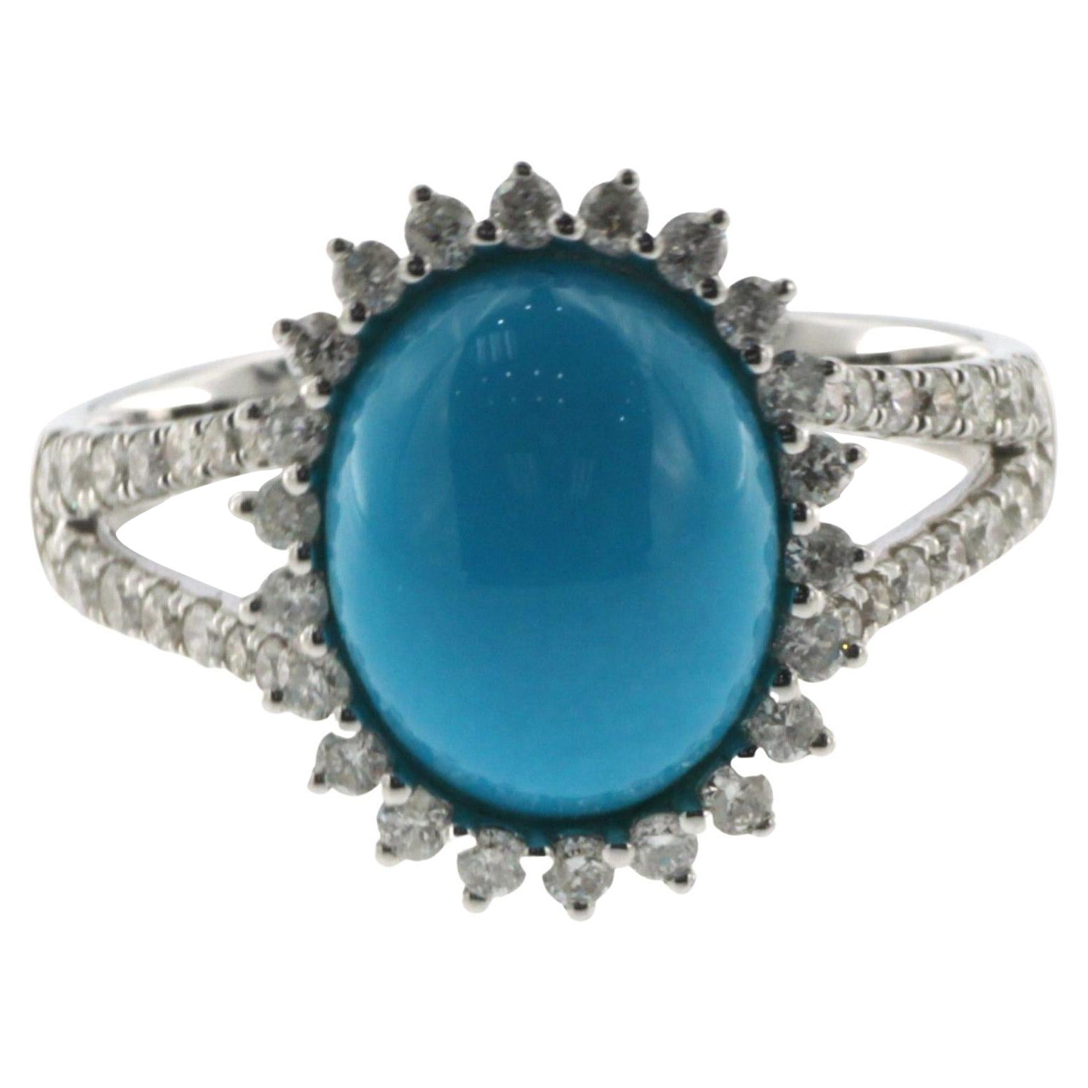 Presenting our exquisite Sleeping Beauty Turquoise Ring, a true gem of elegance and beauty. This captivating piece showcases a stunning 2.65 carat oval cabochon turquoise sourced from the renowned Sleeping Beauty Mine. Known for its pure, light blue