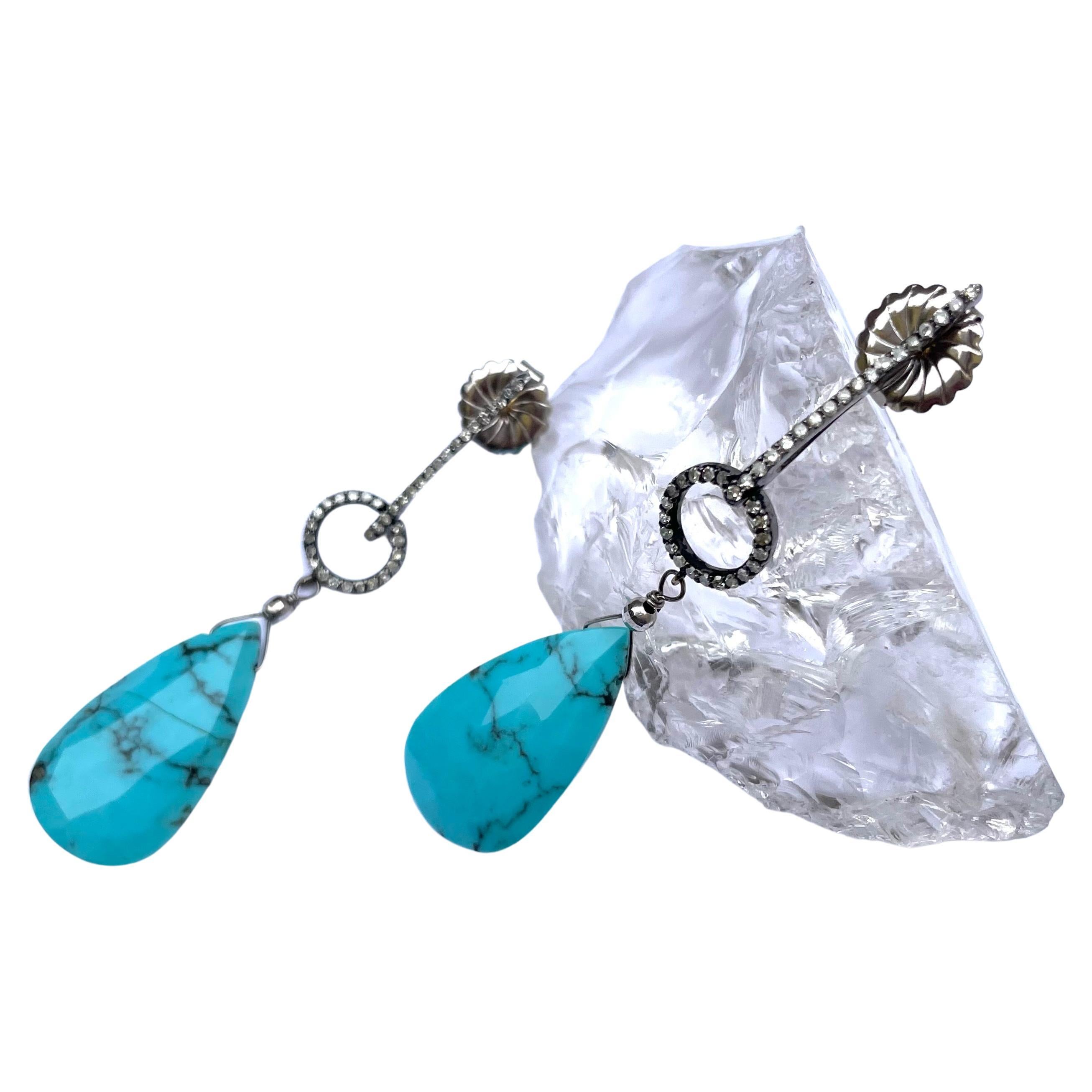 Description
Exquisite Sleeping Beauty turquoise earrings with pave diamonds
Item #E3058

Materials and Weight
Sleeping Beauty turquoise with matrix 26 carats, 16x28mm, pear shape
Pave diamonds
Faceted balls, 3mm, 14k white gold
Posts and jumbo