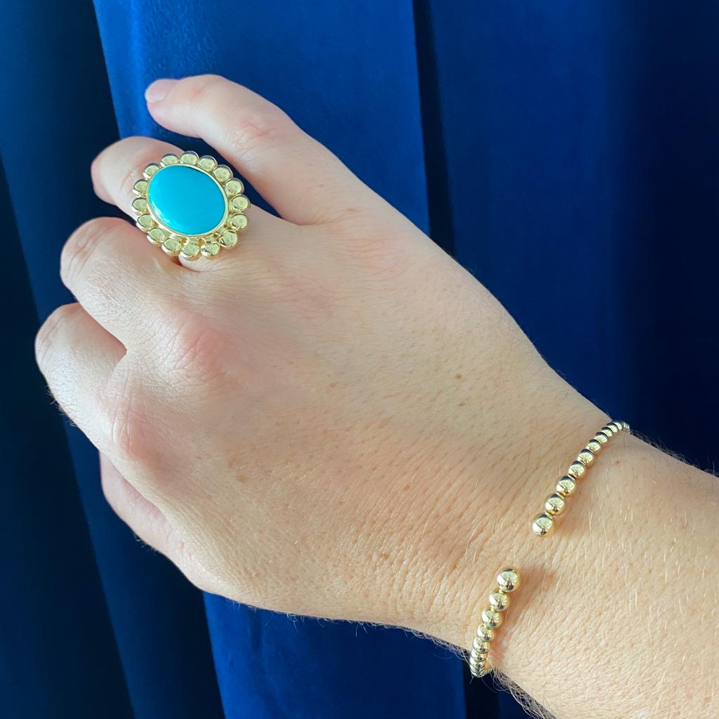 This gorgeous sleeping beauty turquoise was hand-picked by our senior gemologist and paired with rich 18 karat gold. Everything about this ring is smoothly rounded and warm for a fabulous one-of-a-kind statement piece made in a vintage-inspired