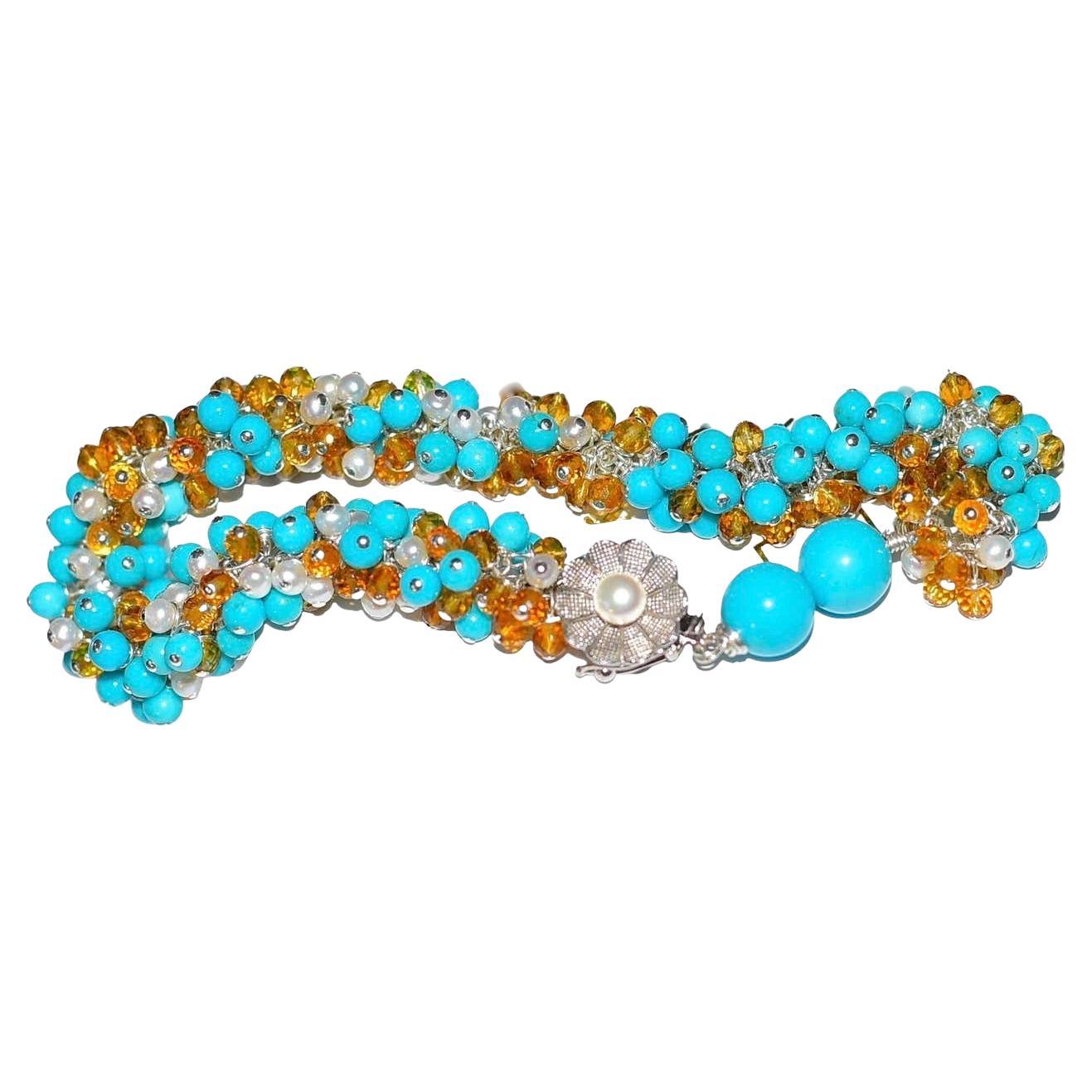 This is such a wonderful bracelet that I would be surprised if you returned it to me! 
Made with Sleeping Beauty Turquoise, Madeira Citrine, and White Seed pearls. 14K Solid White Gold clasp with pearl for decoration and to close.
Beautiful summer-,