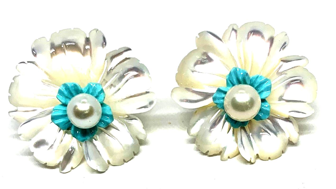 Interchangeable flower earring jackets are finely hand carved in mother-of-pearl, turquoise, and rock crystal quartz. Pearl posts are worn at the center of these earring jackets adding a lovely touch to these beautiful floral earrings. Just right