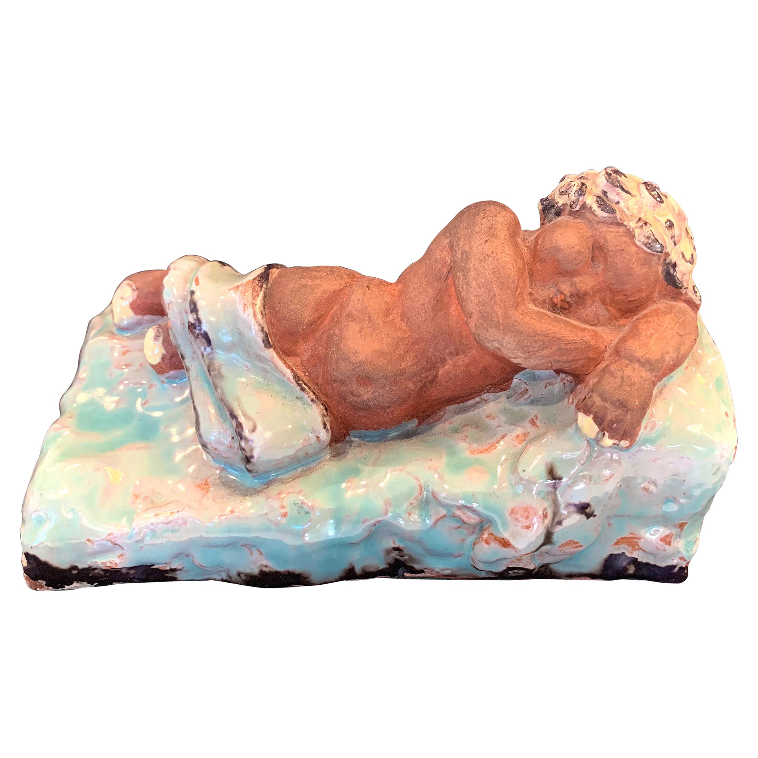 Sleeping Child Bookends, Probably Viennese, with Pale Blue and Yellow Glazes For Sale