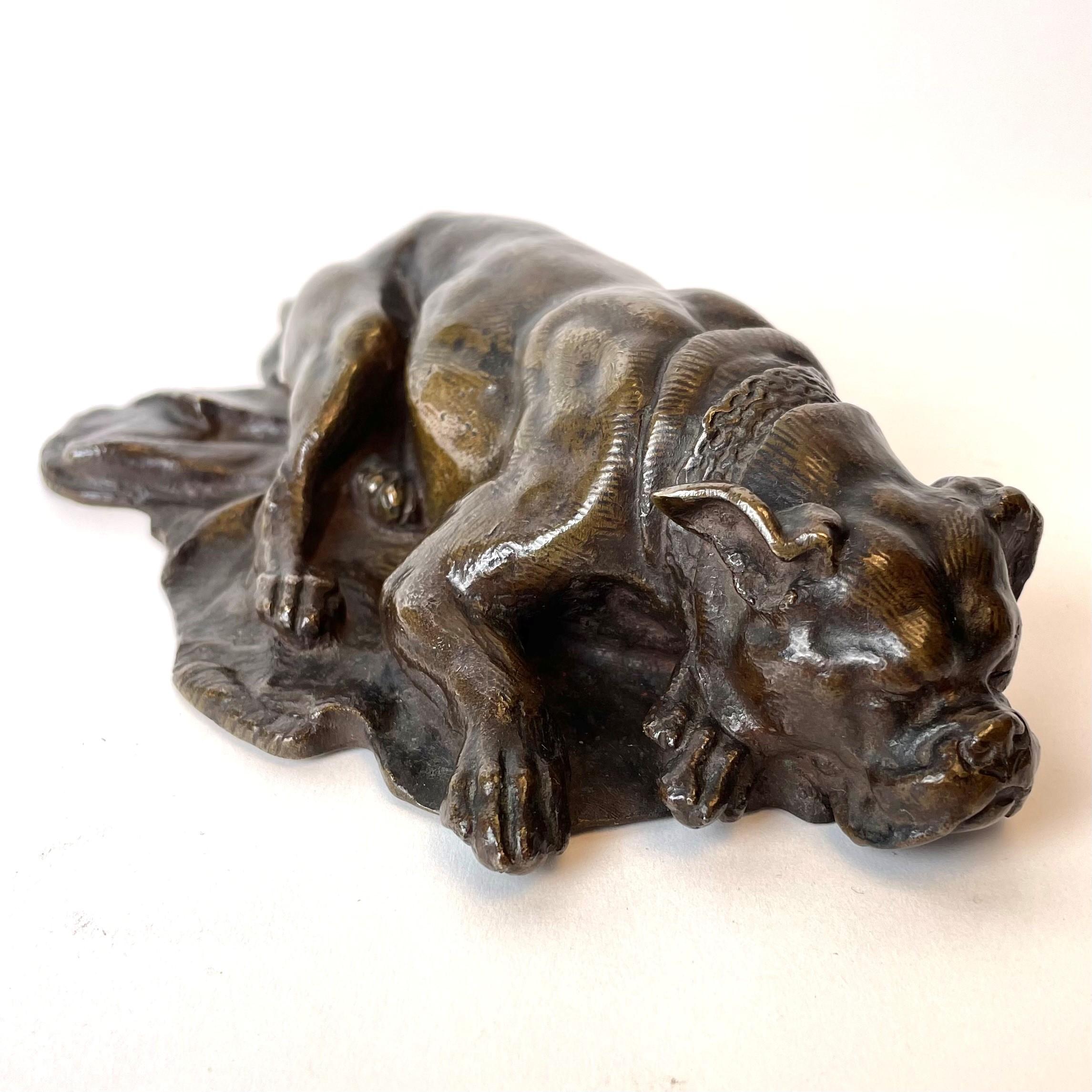 A charming sleeping dog in patinated bronze by Antoine-Louis Barye (France 1796-1875). Signed Barye. Probably Mid-19th Century.

Wear consistent with age and use.