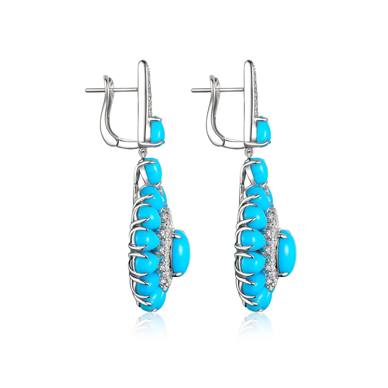 This earring features 16.30 carats of sleeping beauty mine turquoise. Sleeping Beauty Mine. Famous for it solid, light blue color with no matrix. Assented with 0.56 carats of white round brilliance diamonds. Earrings are set in 14 karat white gold.