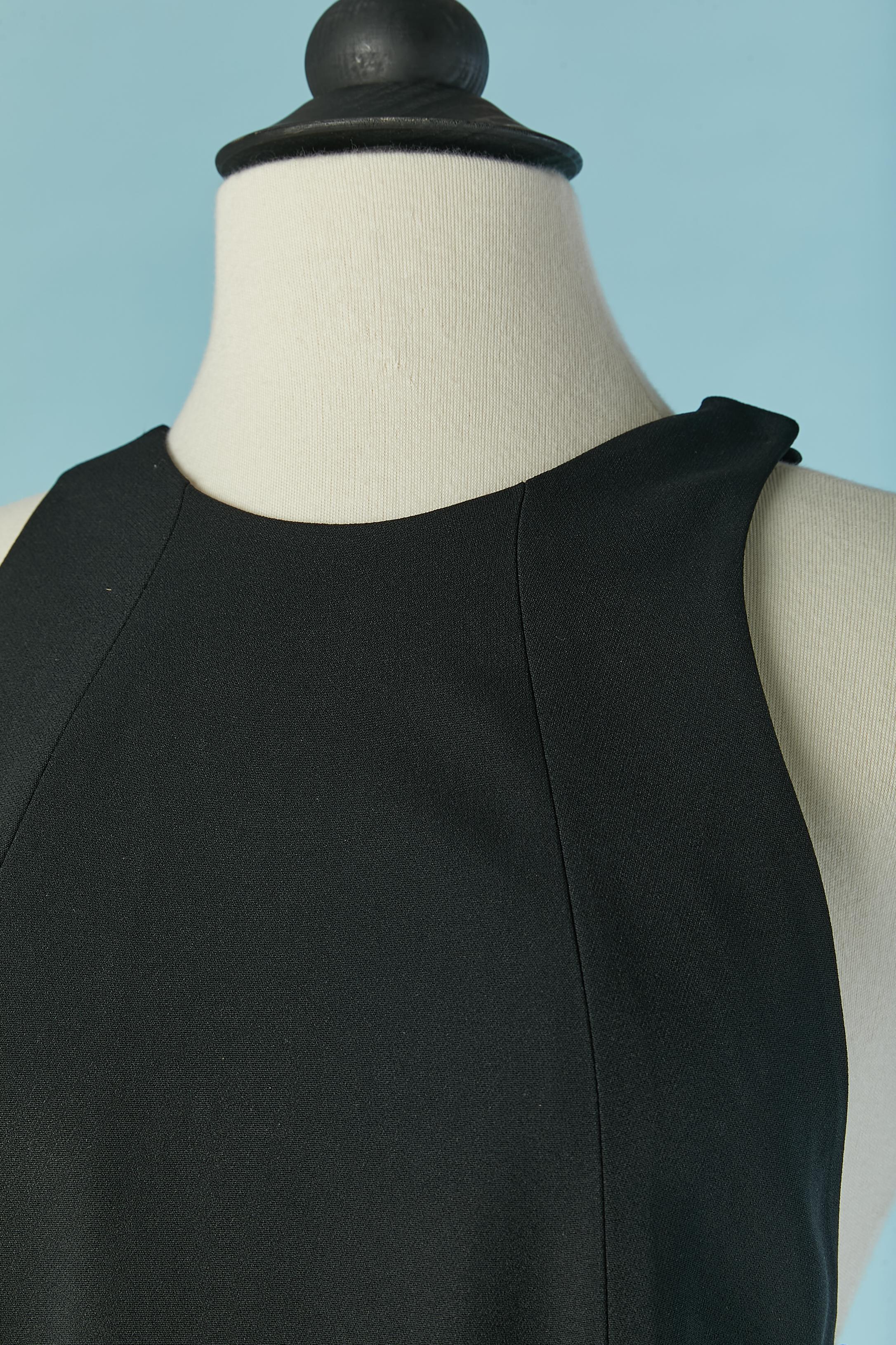 Sleeveless backless black evening dress with eyelet and split on the side front, lenght = 98cm
main fabric composition: 52% acetate, 45% rayon, 3% elasthane. Lining composition: 57% rayon, 43% polyester. 
Invisible zip closure on the left side. Snap