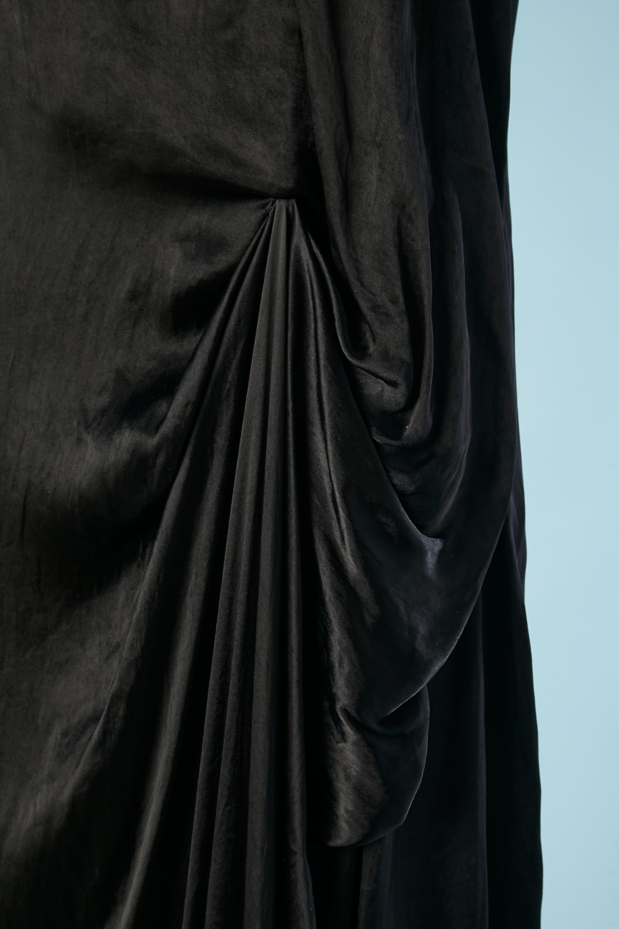 Sleeveless black evening dress drape on the side. Collection 