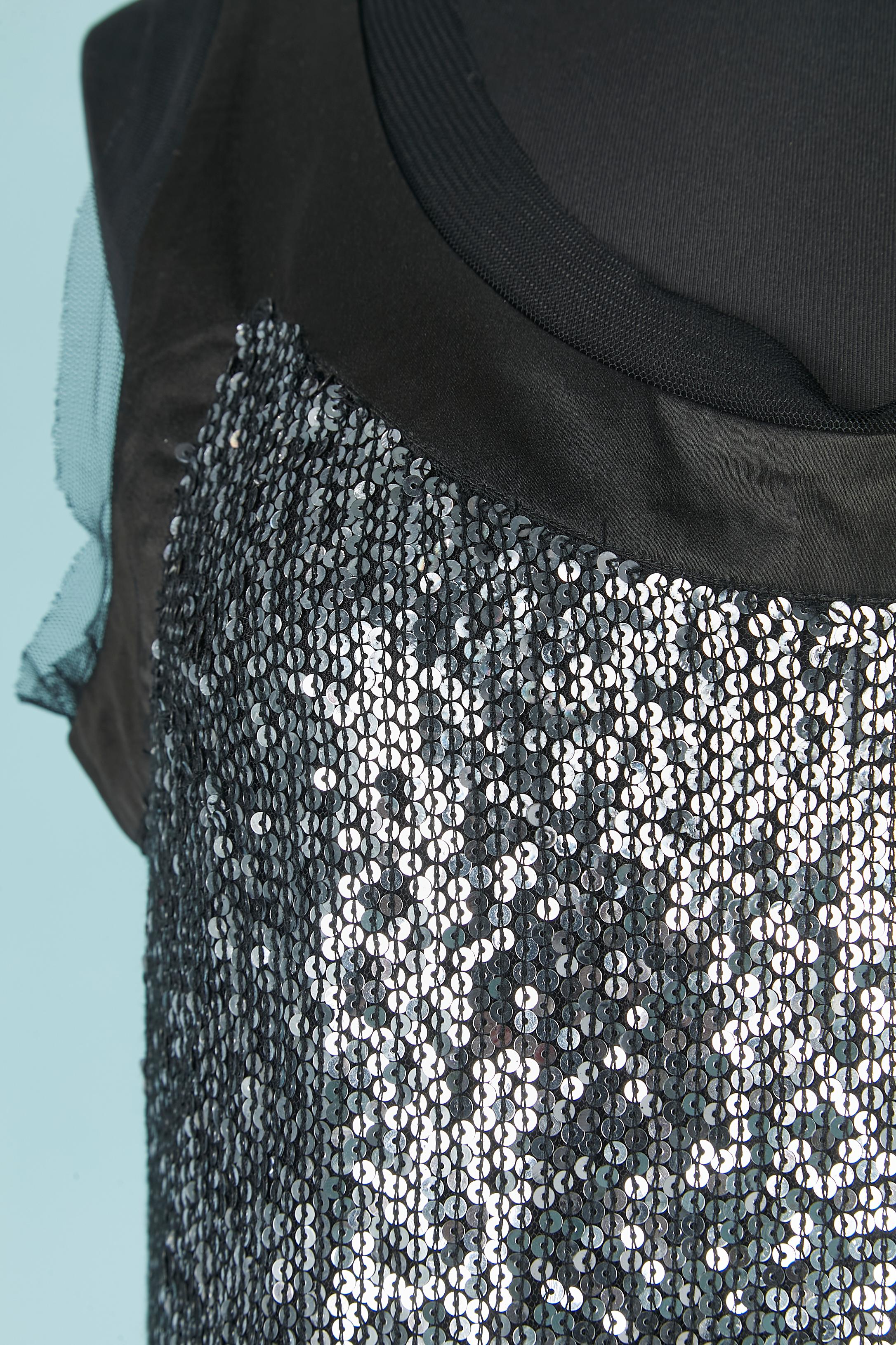 Sleeveless cocktail dress in sequin dégradé from silver to gold. Fabric 1 composition: Nylon. Fabric 2 ( the black one): polyester. Tulle edge on the neckline and bottom. Black slip dress lining. 
Authenticity hologram.
SIZE 44 / L 