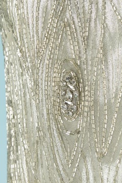 Sleeveless cocktail dress with beadwork and rhinestone embellishment Circa 1960