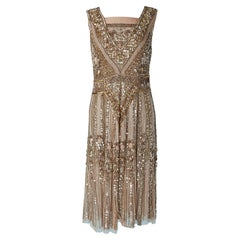 Sleeveless cocktail dress with gold sequin embroideries 1920's style