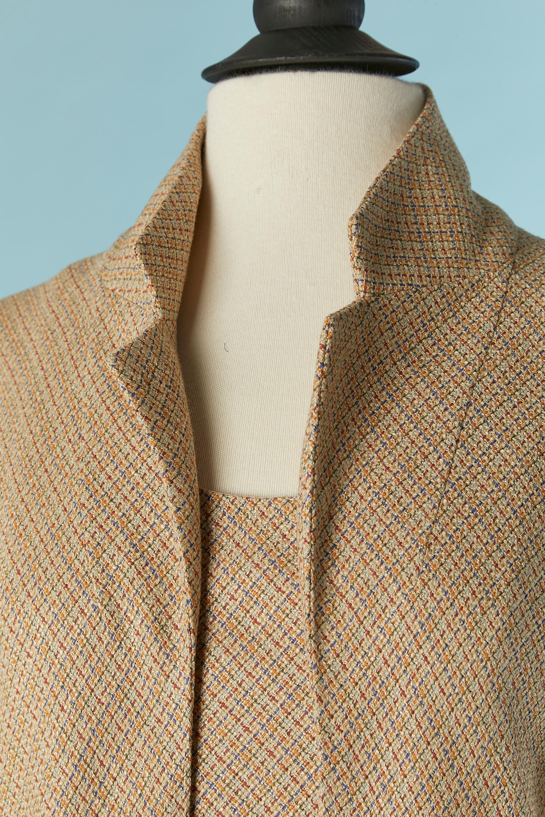 Sleeveless dress and coat ensemble in thin wool (62%) and silk ( 38%) tweed. No lining inside the coat and branded silk lining inside the dress. 
Zip and hook&eye closure on the back of the dress, no front closure on the coat. 
SIZE 38 (Fr) M 