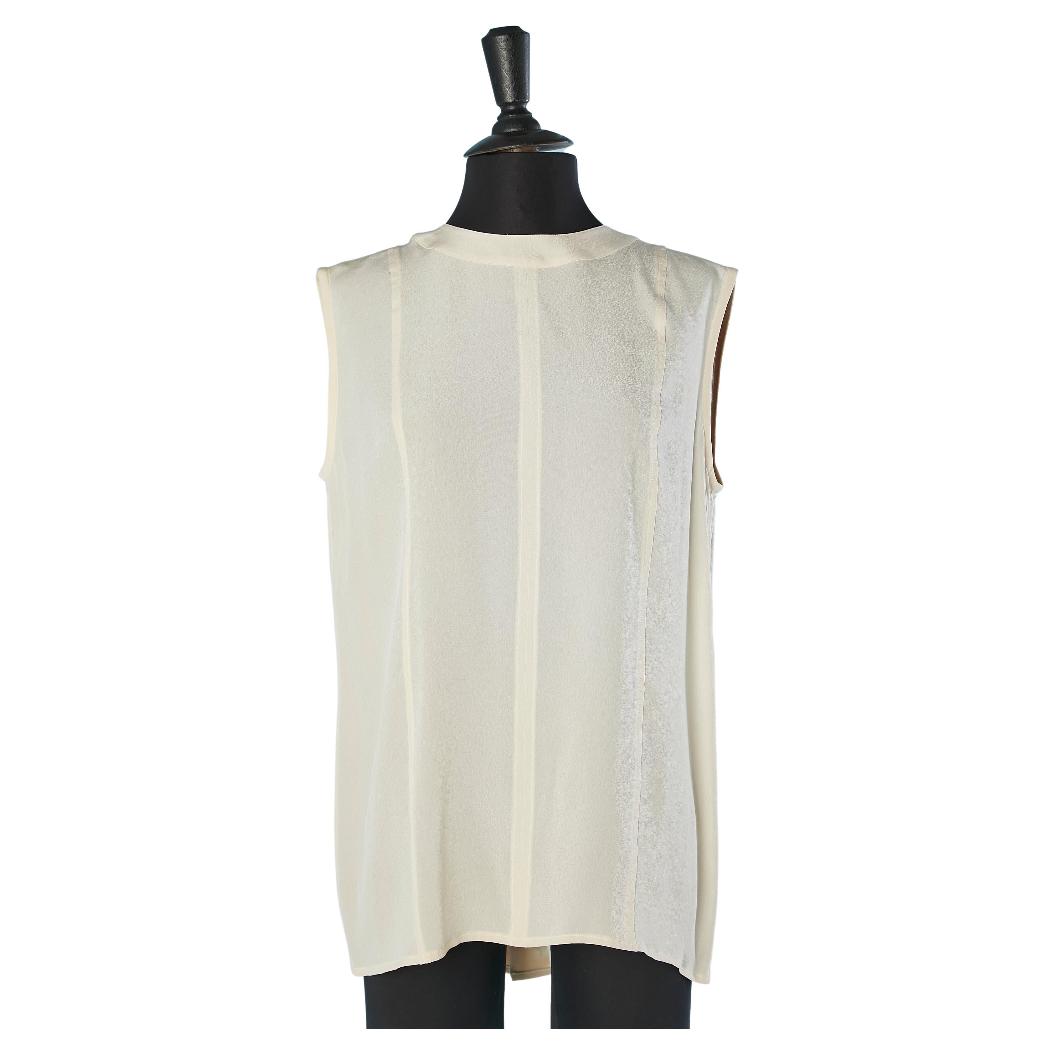Sleeveless ivory top with buttons in the middle back Chanel Boutique