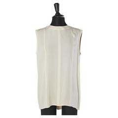 Sleeveless ivory top with buttons in the middle back Chanel Boutique 