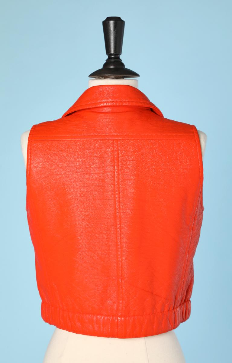 orange sleeveless blazer